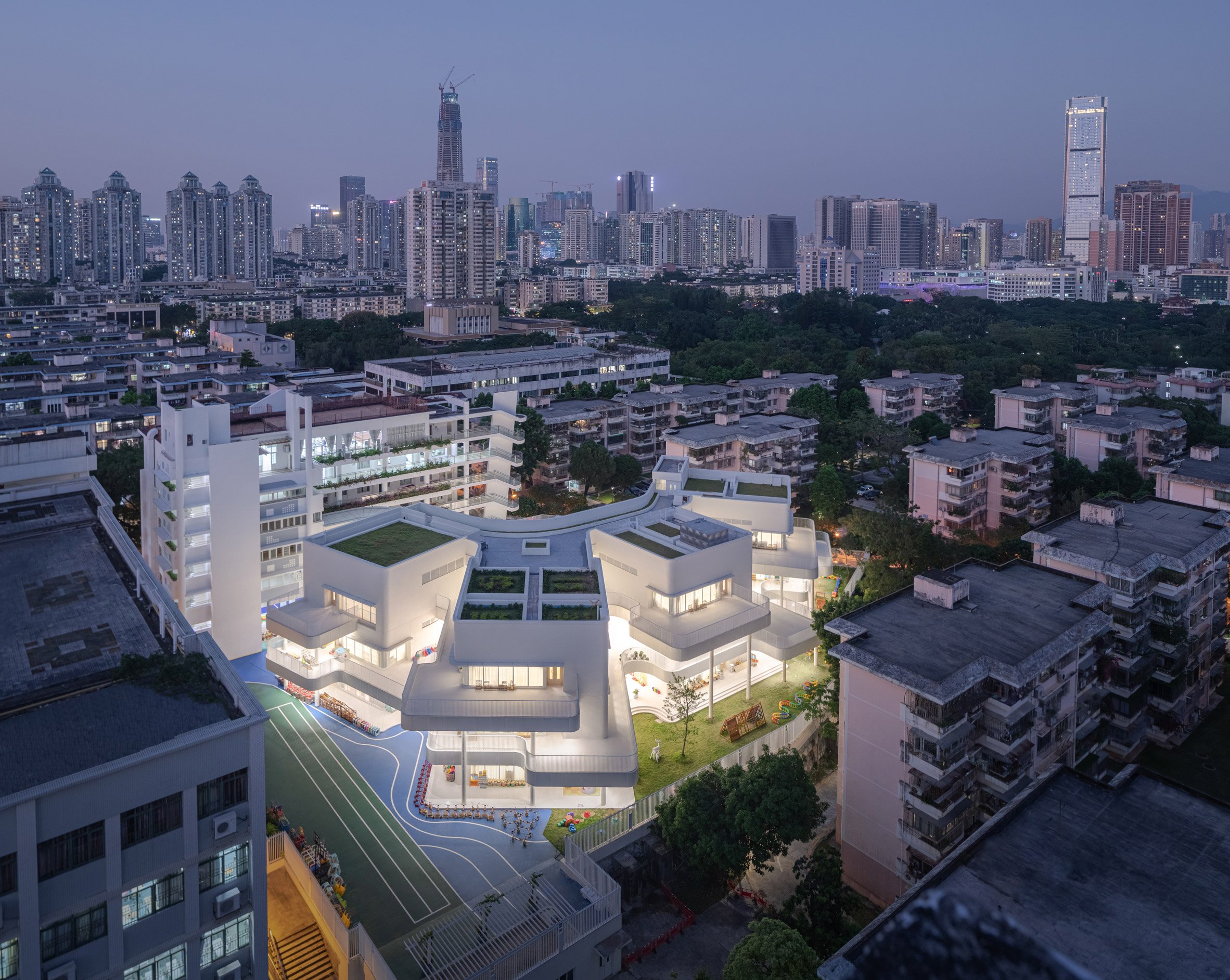 Staggered white balconies at Kindergarten of Museum Forest by Atelier Apeiron