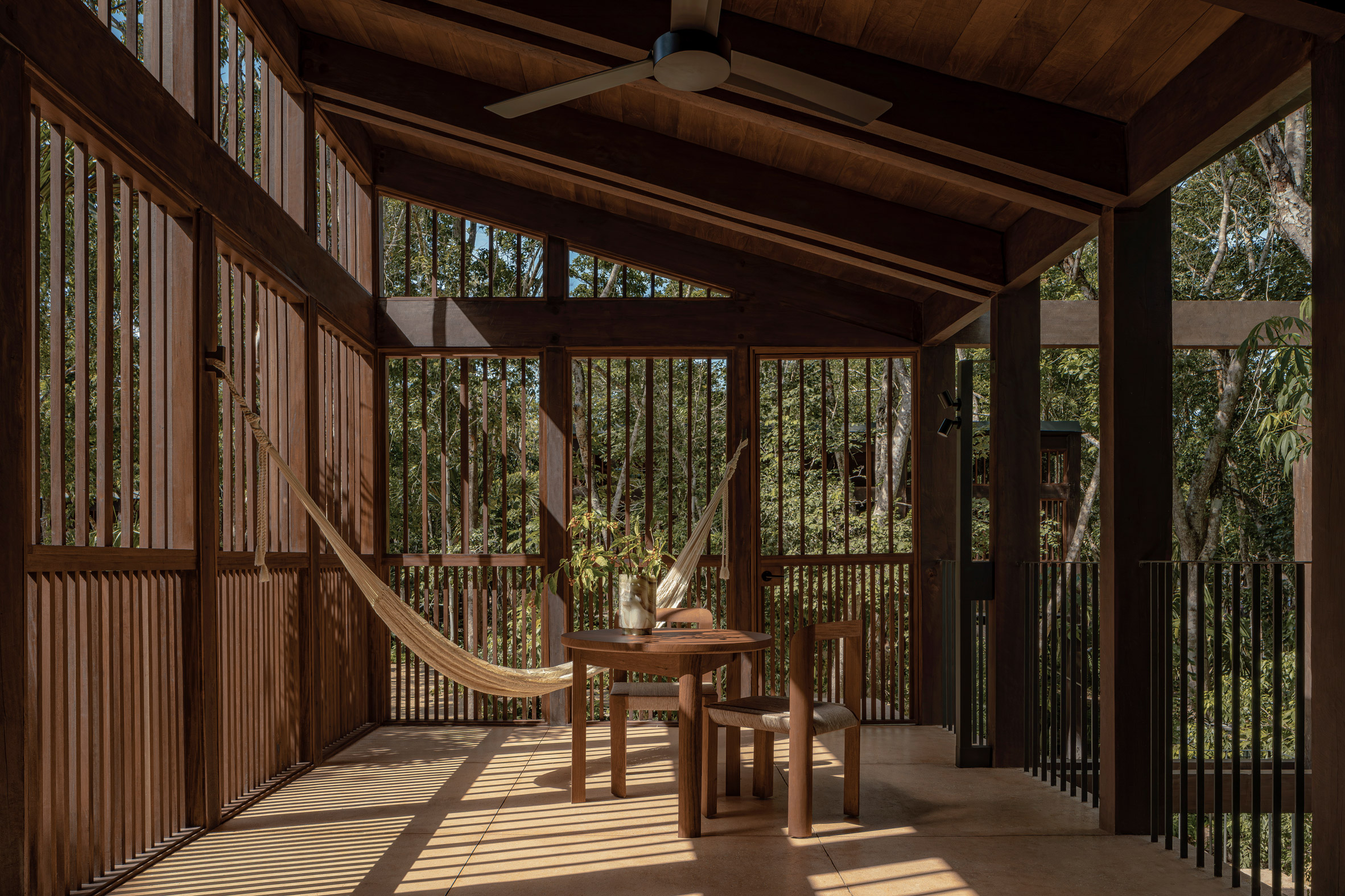 A treehouse room with a hammock