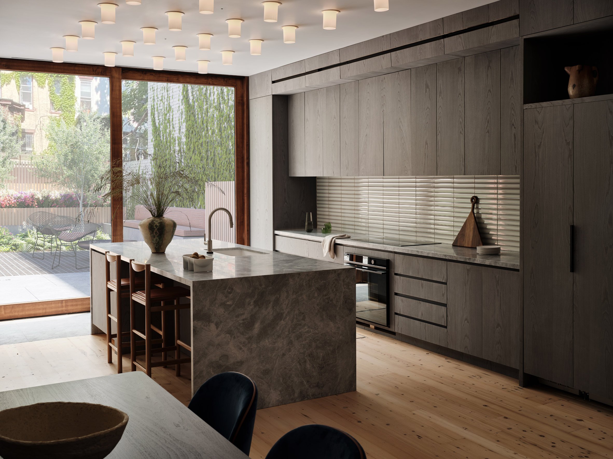A kitchen with a gray colour palatte