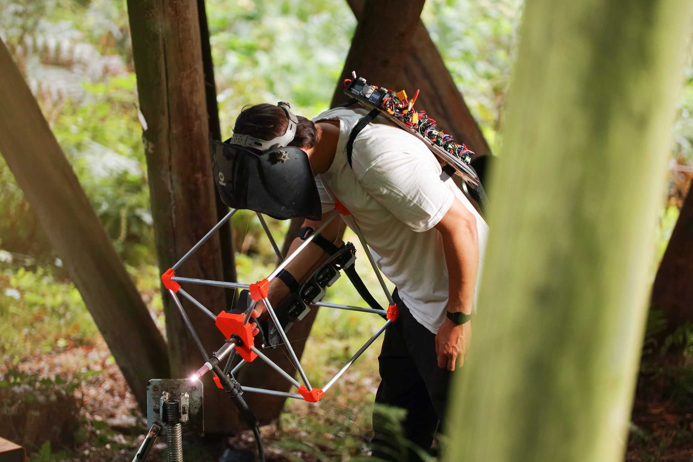 Photo of engineer Jasper Mallinson wearing the Mecha-morphis device on one arm