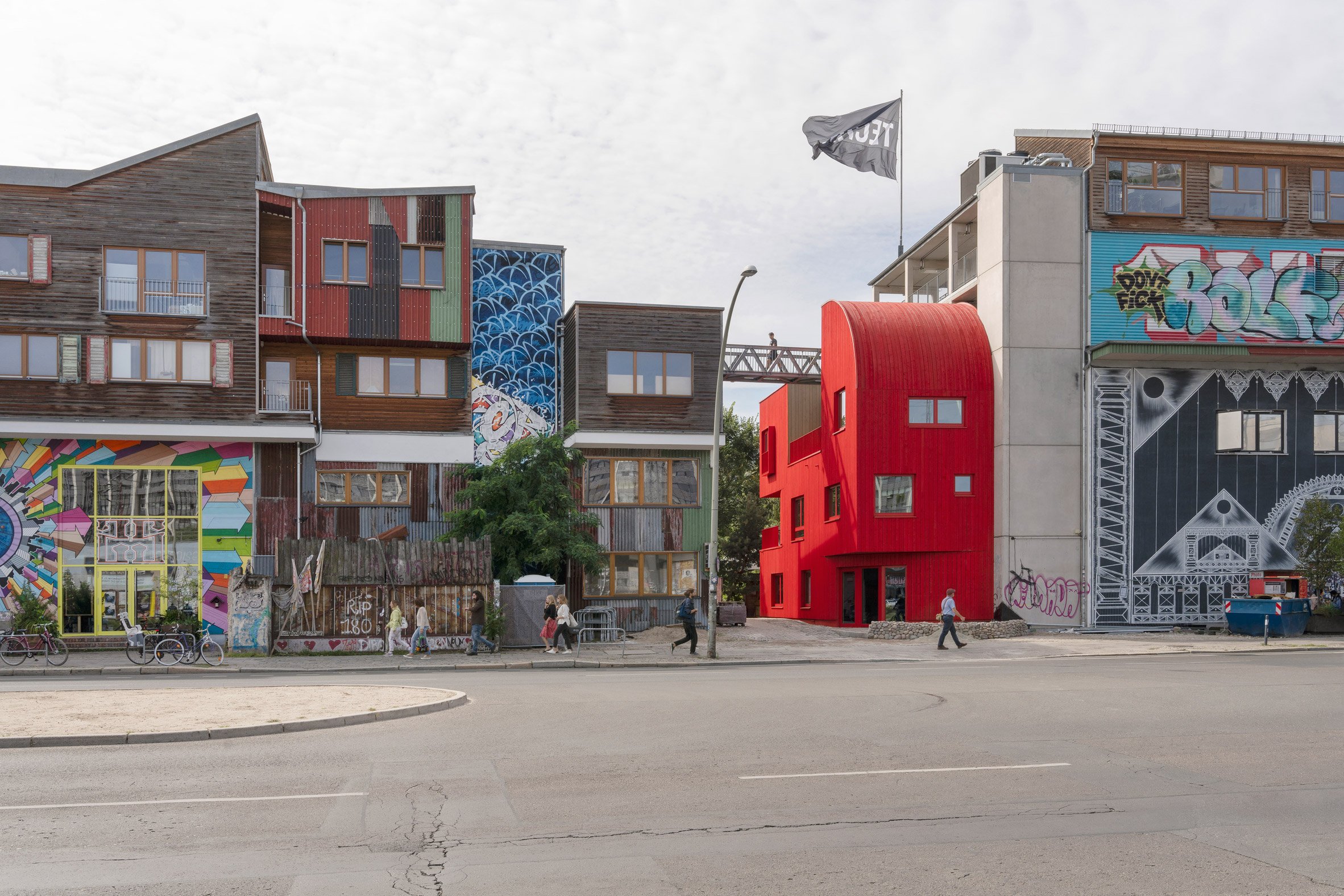Red timber Haus 2+ office building by Office ParkScheerbarth