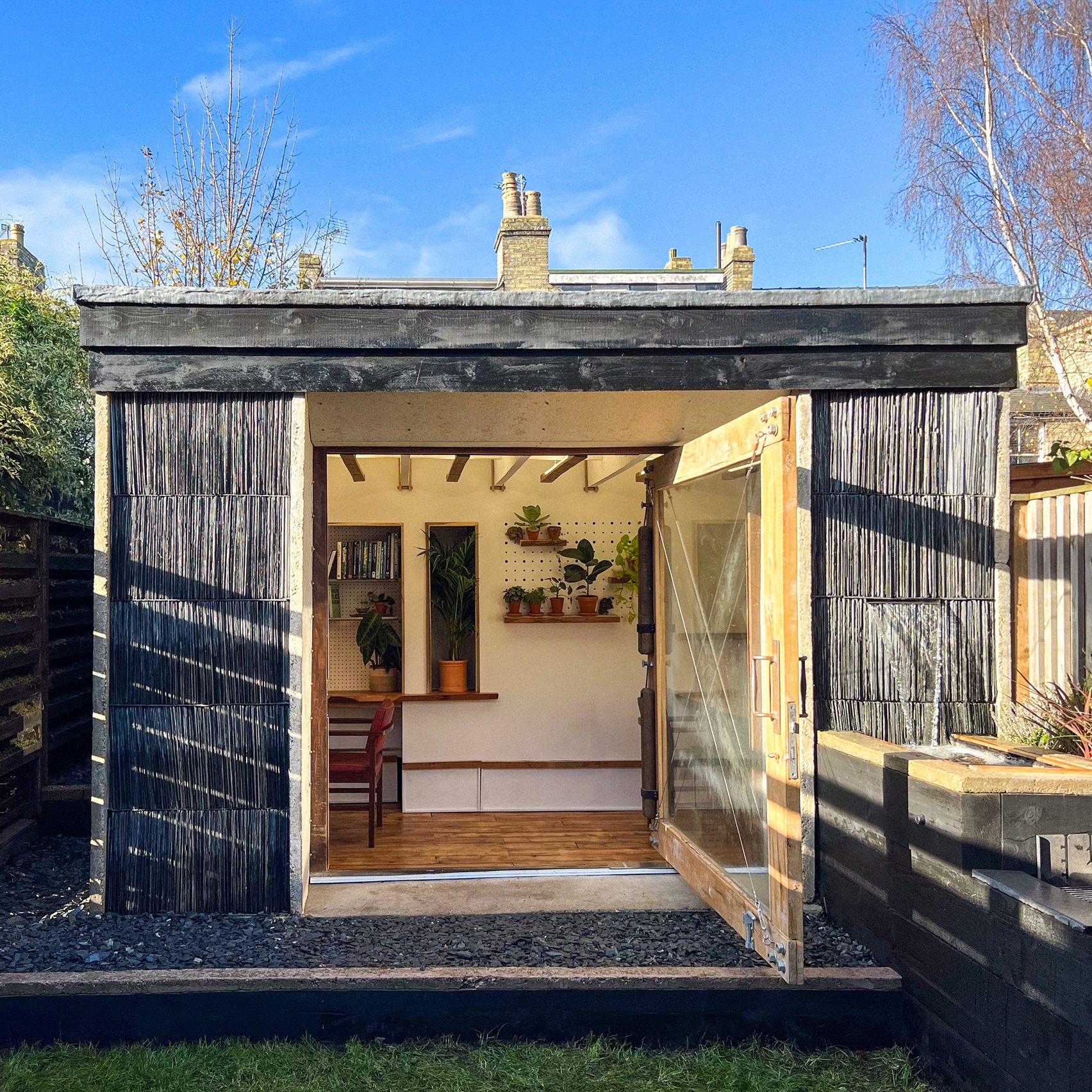 Outbuilding clad in slate tiles