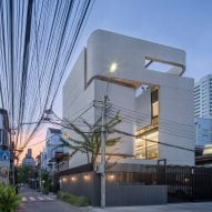 Sunset view of the exterior of 55 Sathorn house by Kuanchanok Pakavaleetorn Architects