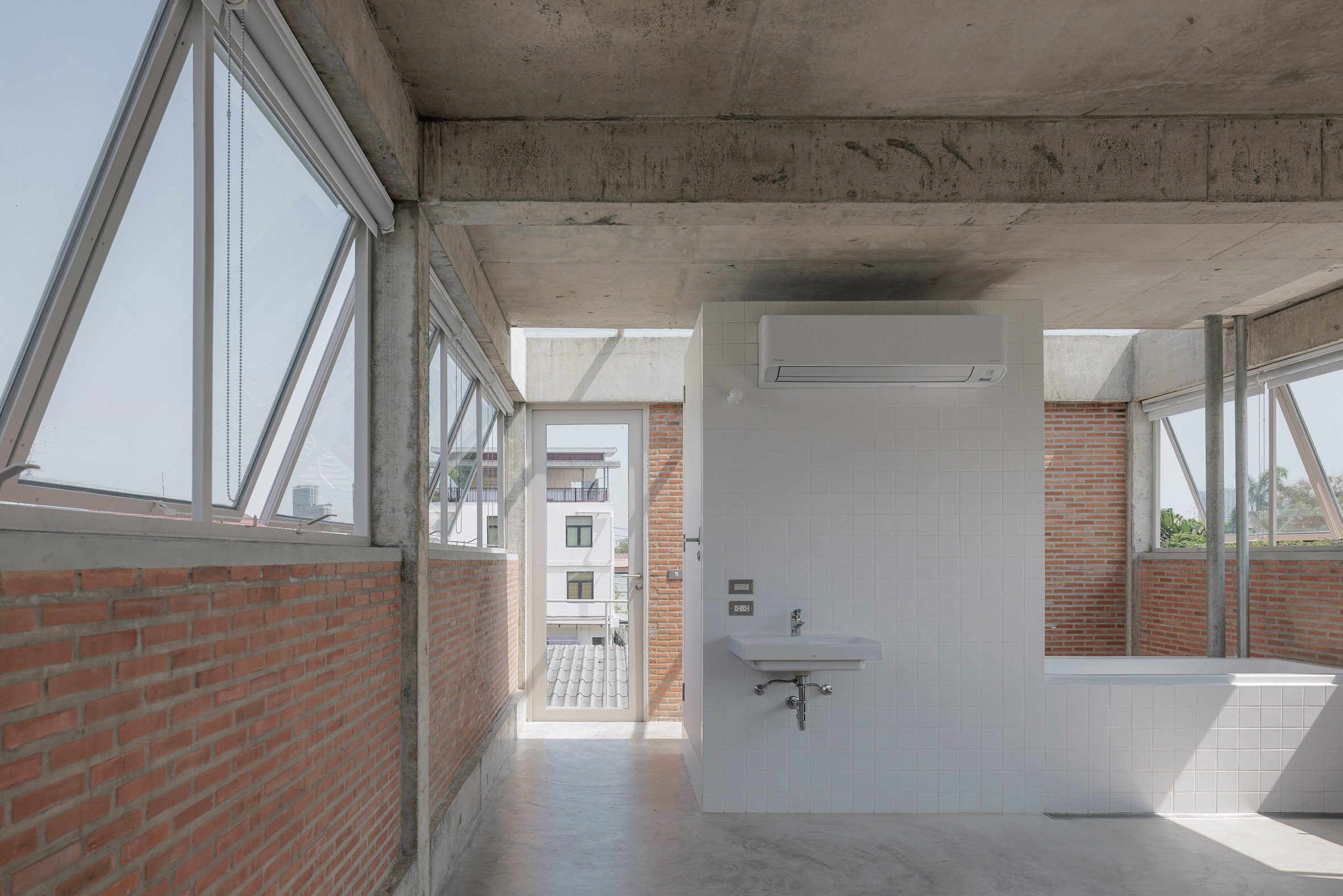 white tiled partitions and bathroom