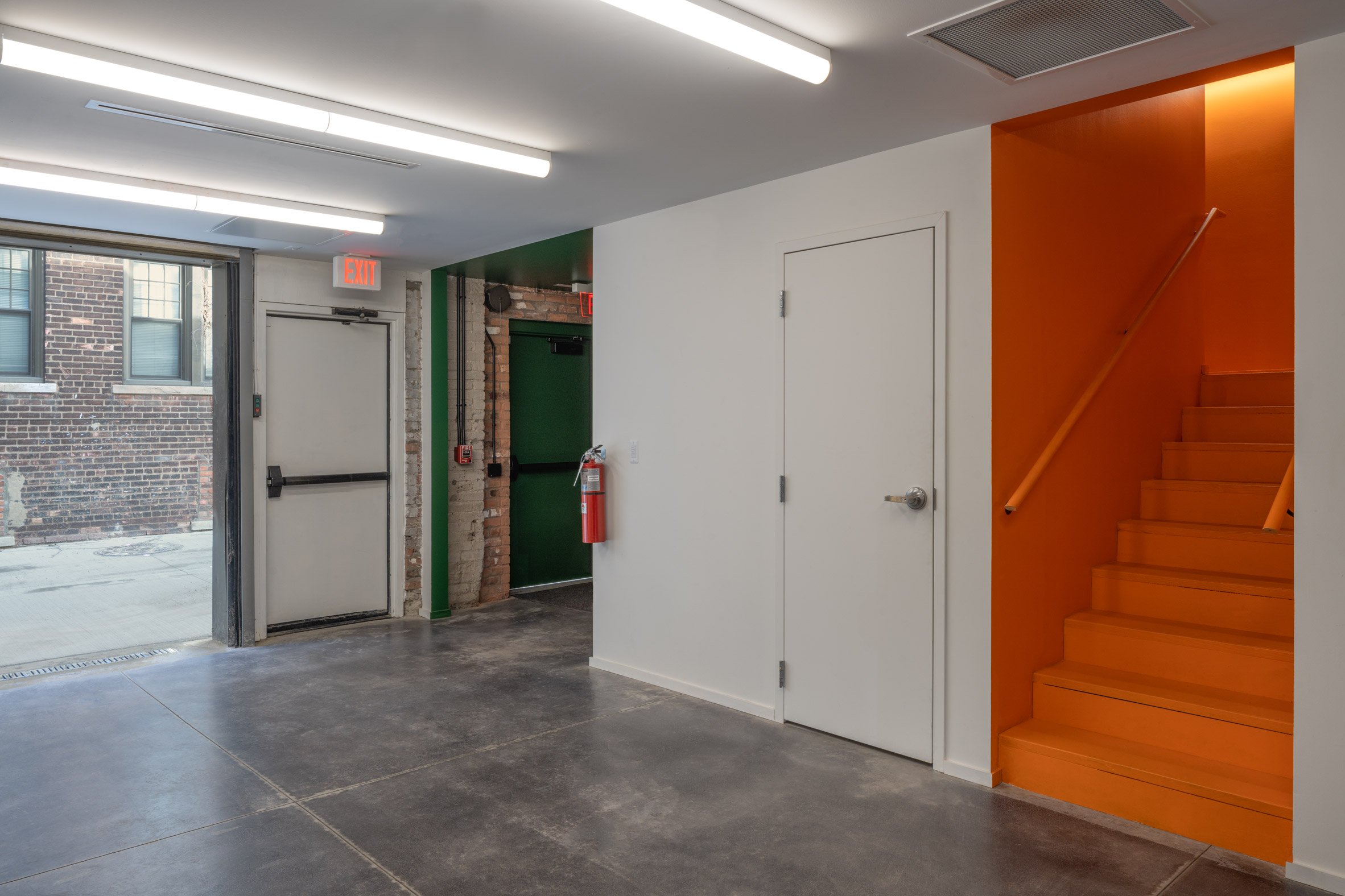 White wall with colourful staircase in theatre