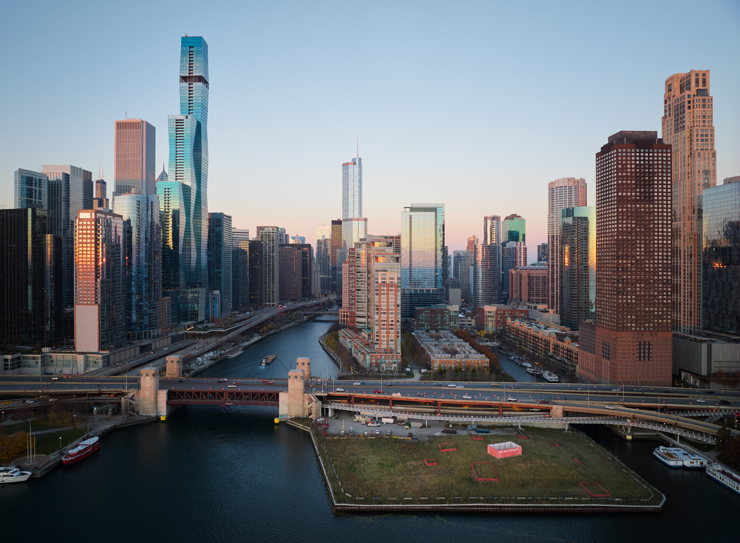 Chicago River with skyline and a pavilion on a park on the lake