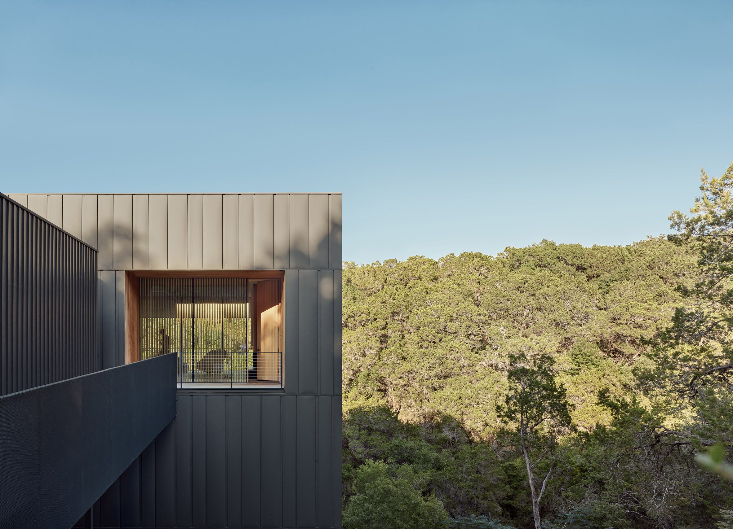 window in house with steel cladding