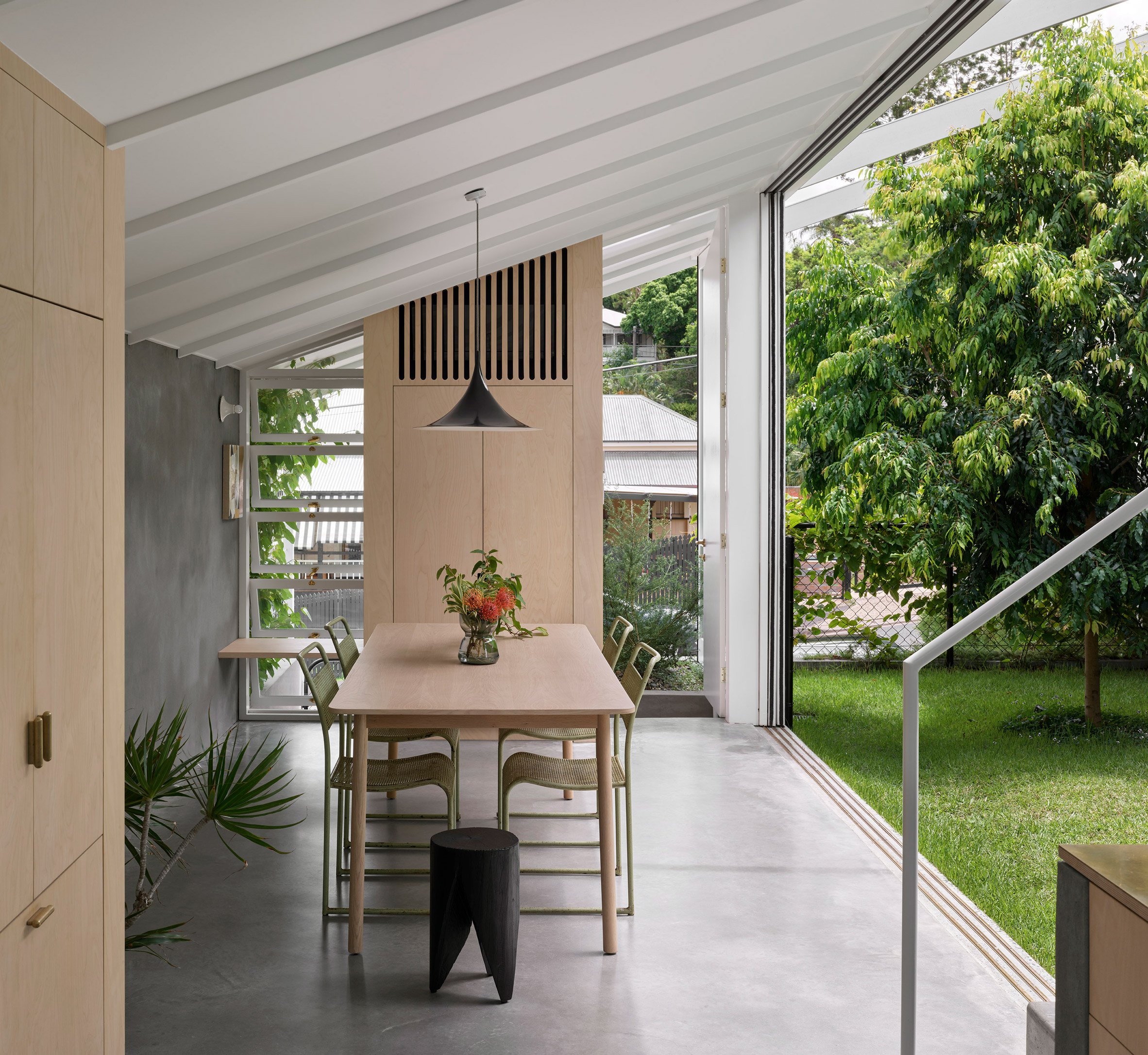 Dining room at Cascade House opening onto a garden