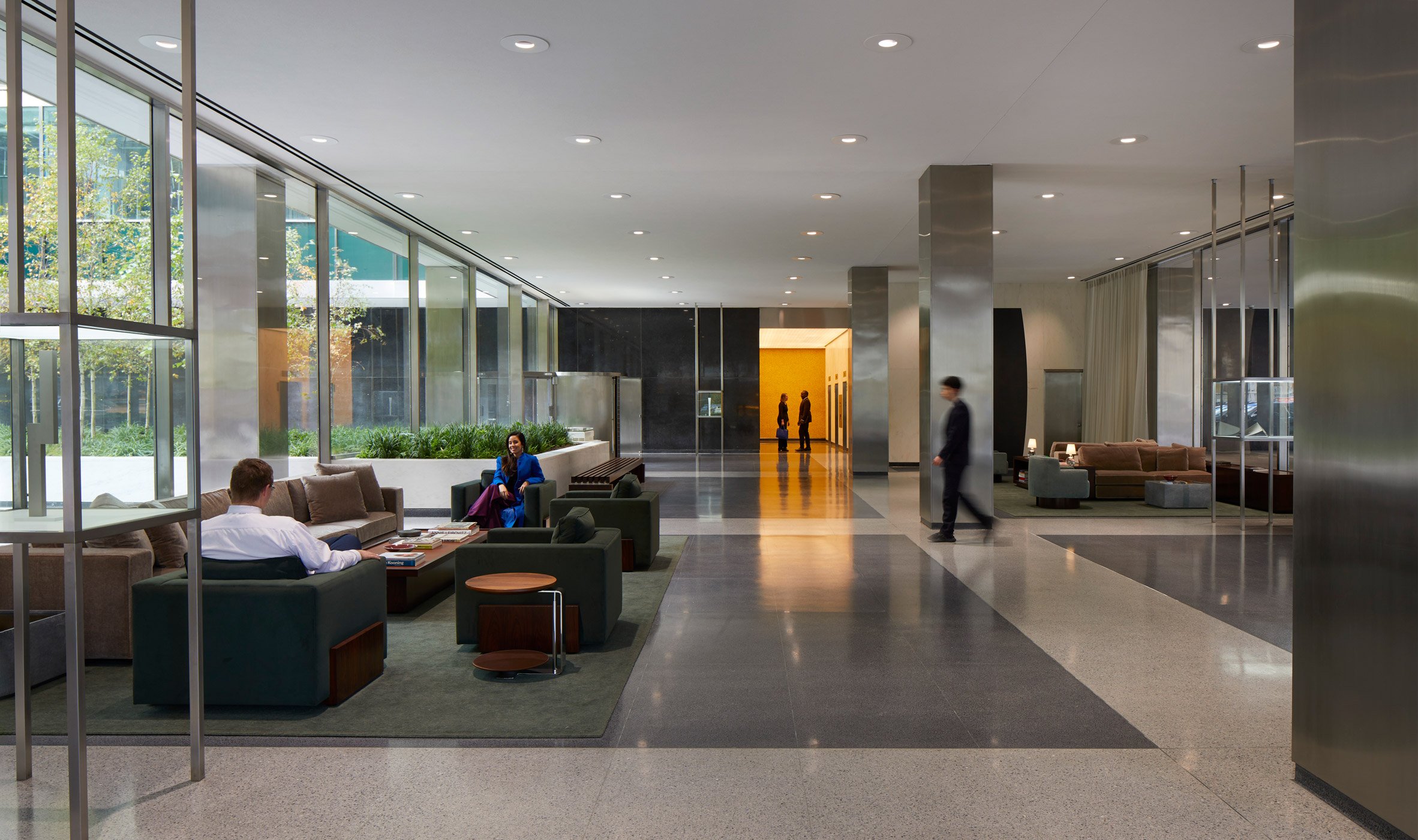 A lobby building with velvet furniture