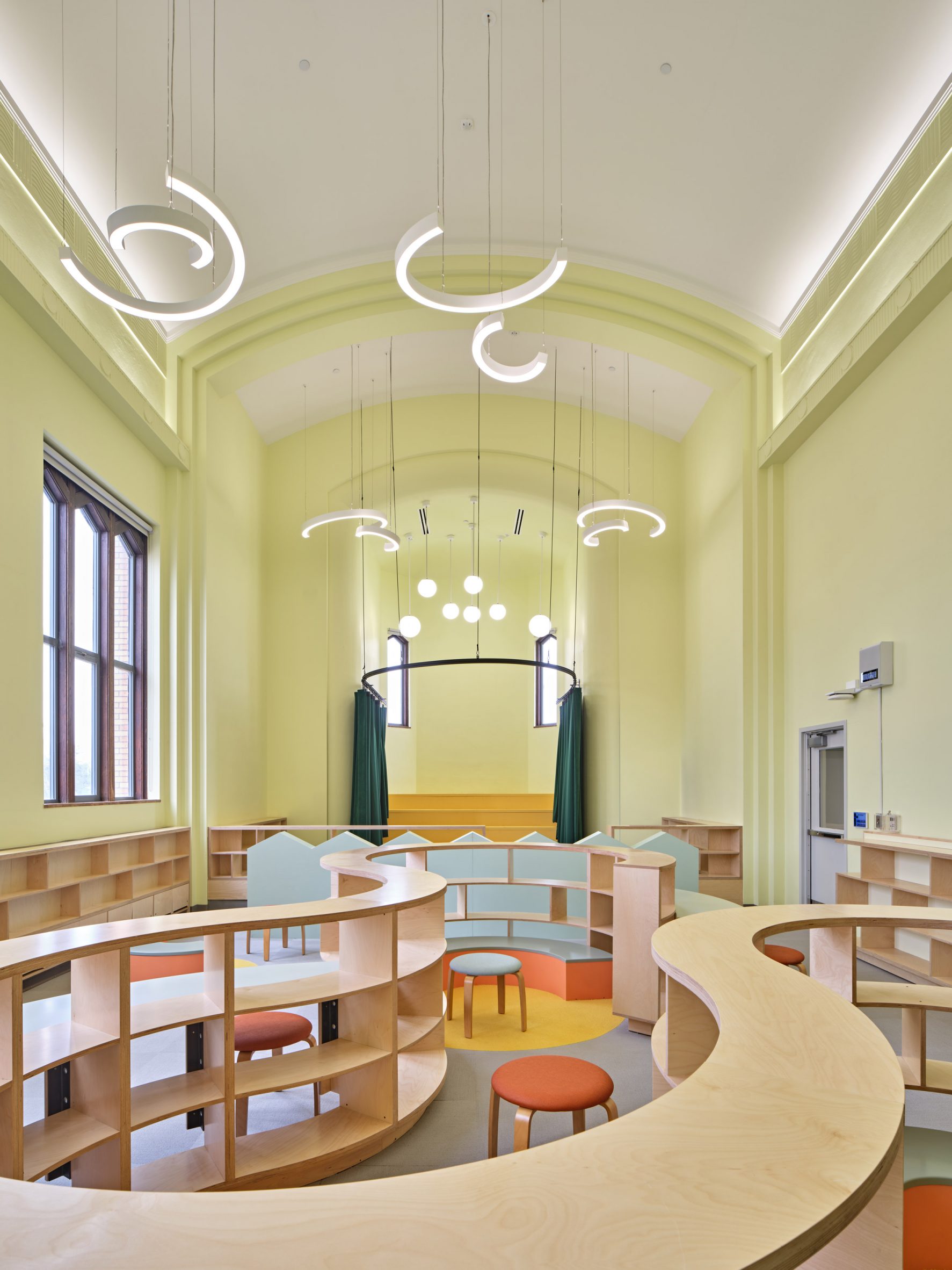 School room with green walls and vaulted ceiling