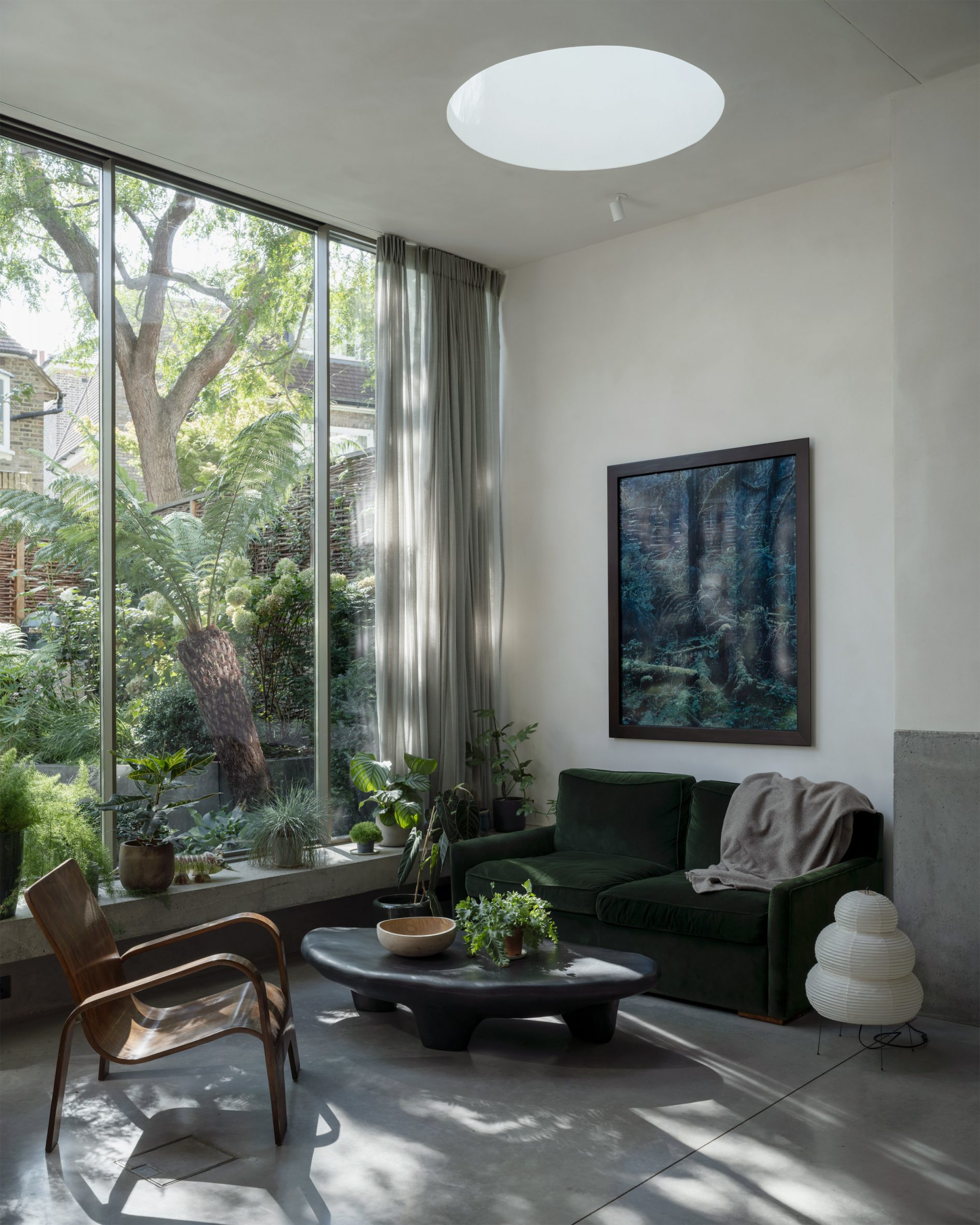 Interior ground floor overlooking garden in Brutalist Chelsea townhouse by Pricegore
