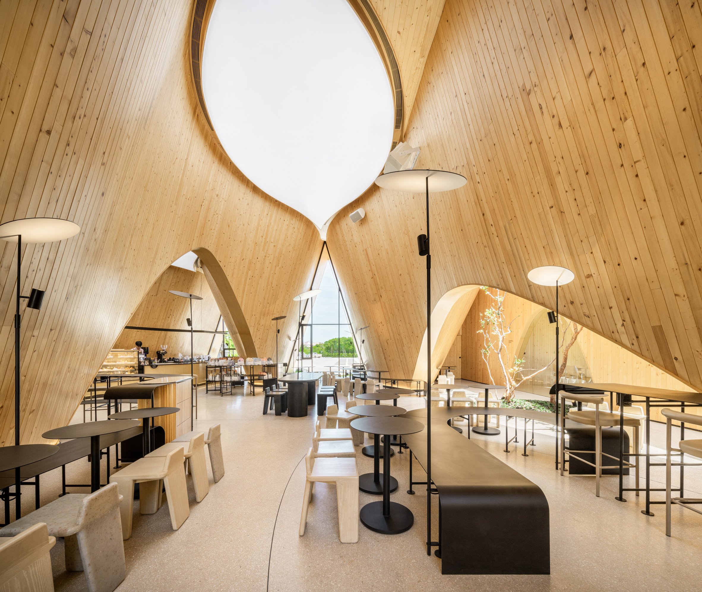 Wood-lined interior of Harudot cafe by IDIN Architects