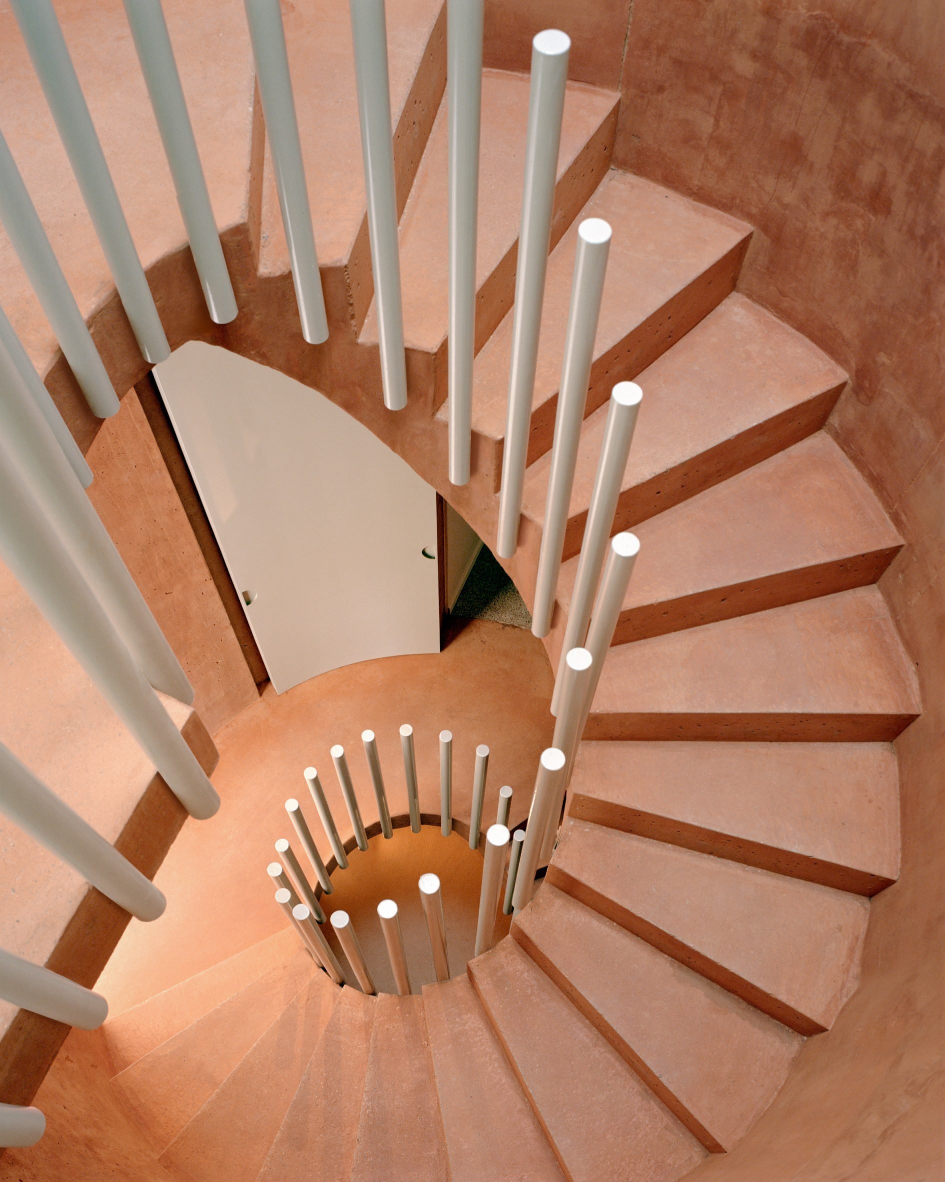 Concrete stairwell within home renovation by Atelier Delalande Tabourin