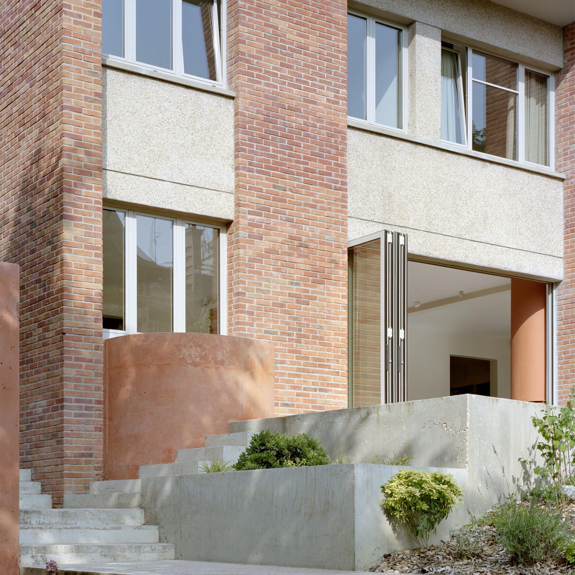 Exterior view of home in France by Atelier Delalande Tabourin