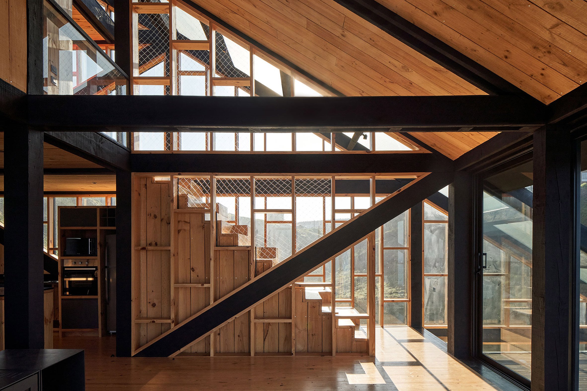 Geometric staircase within home by WMR Arquitectos