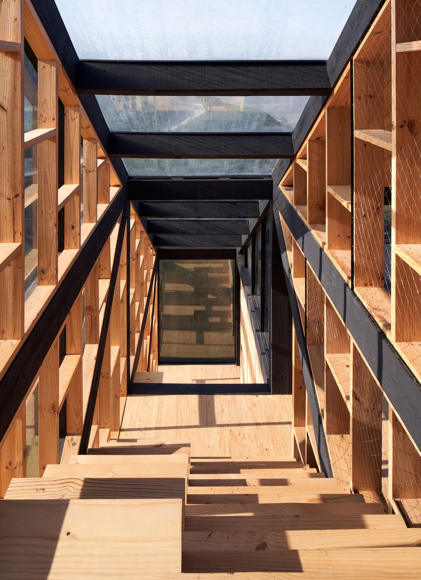 Timber staircase within cliffside house