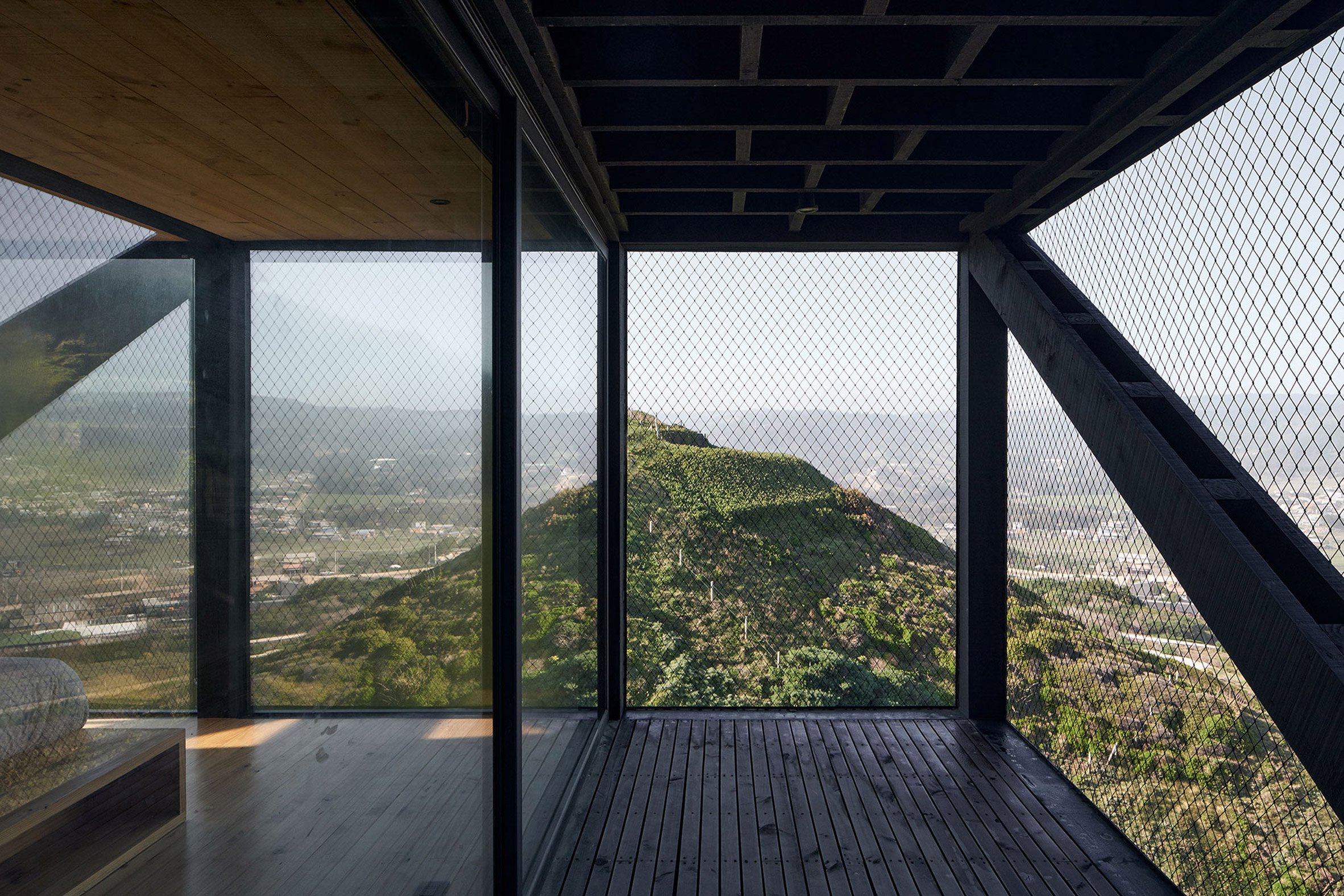 Bedroom and terrace at Casa Ladera by WMR Arquitectos