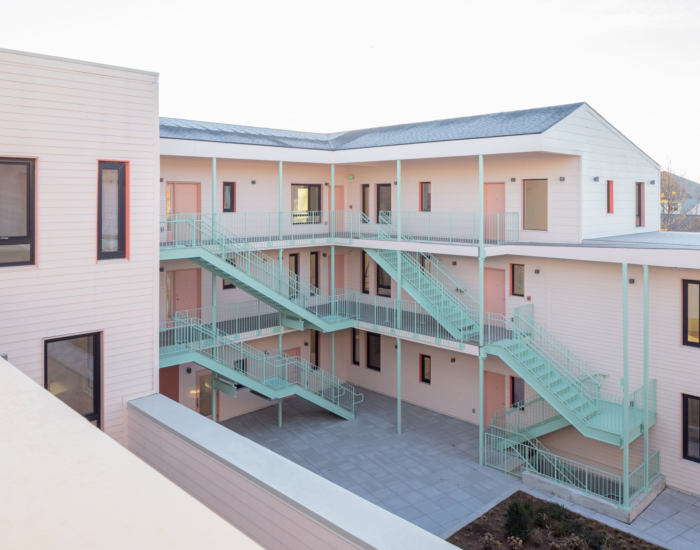 Co-housing complex with pale pink walls