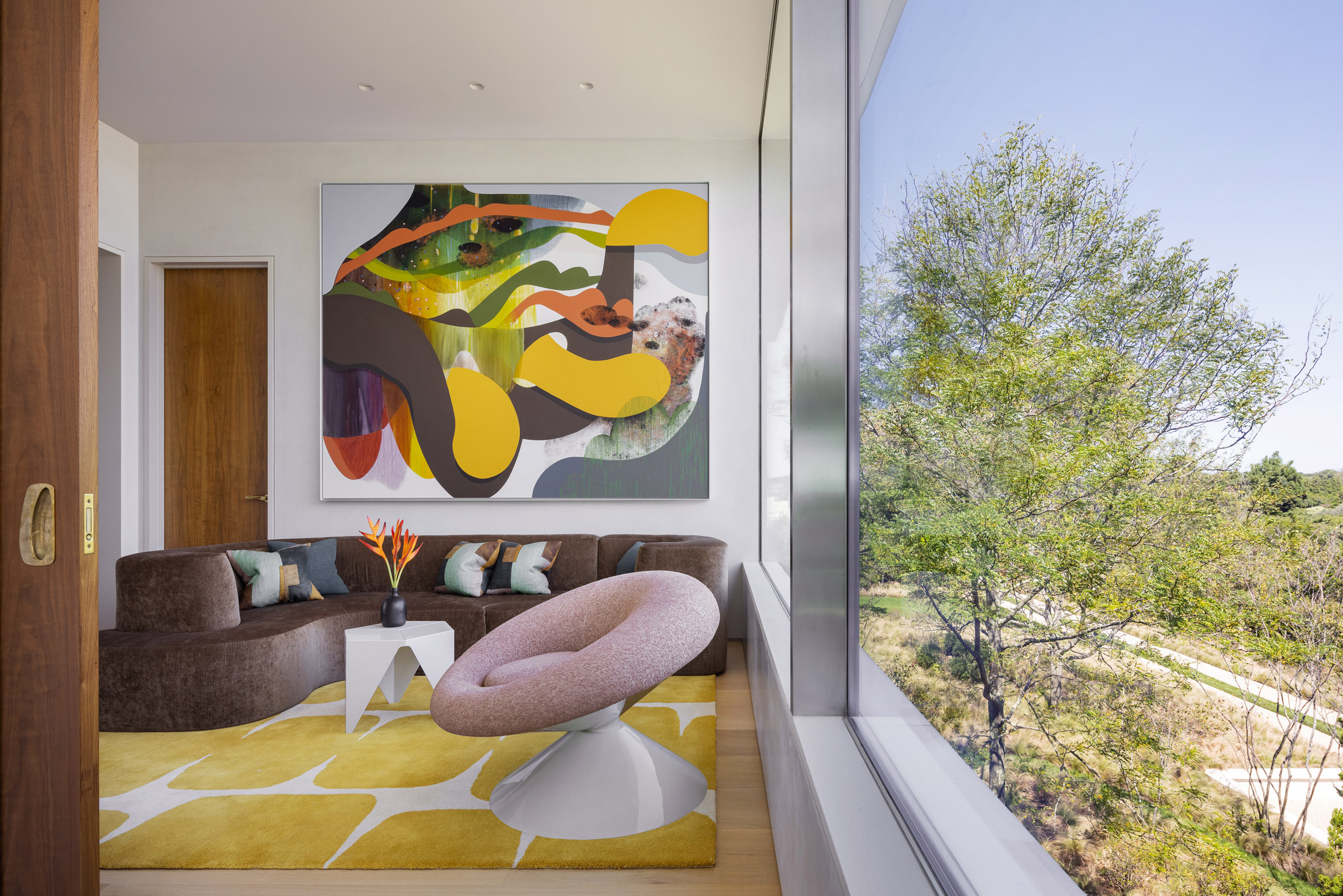 Colourful furniture and large glass windows