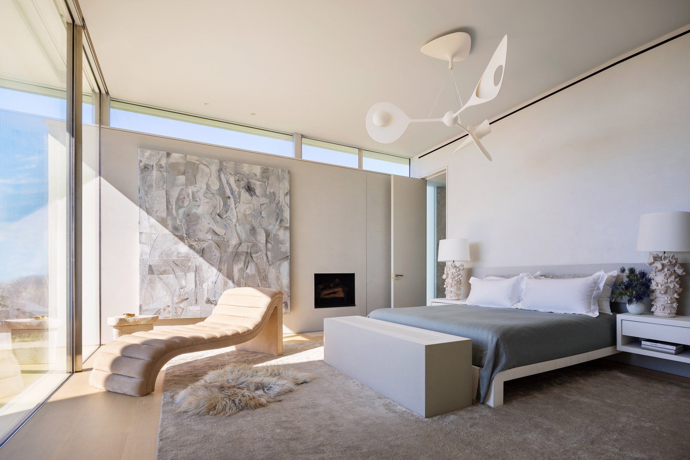 Primary bedroom with sculptural furniture