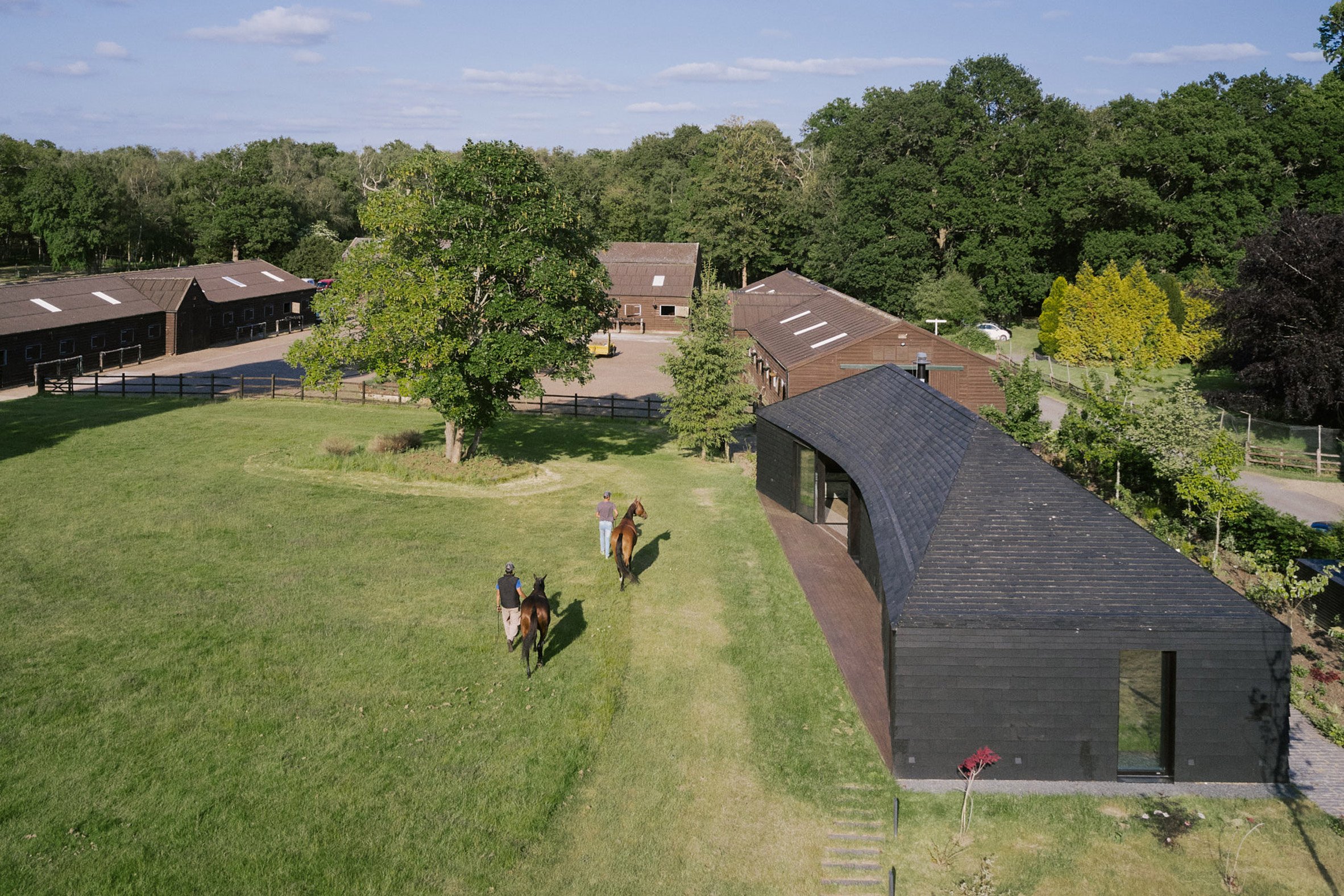 Exterior of clubhouse at Arc Polo Farm by DROO