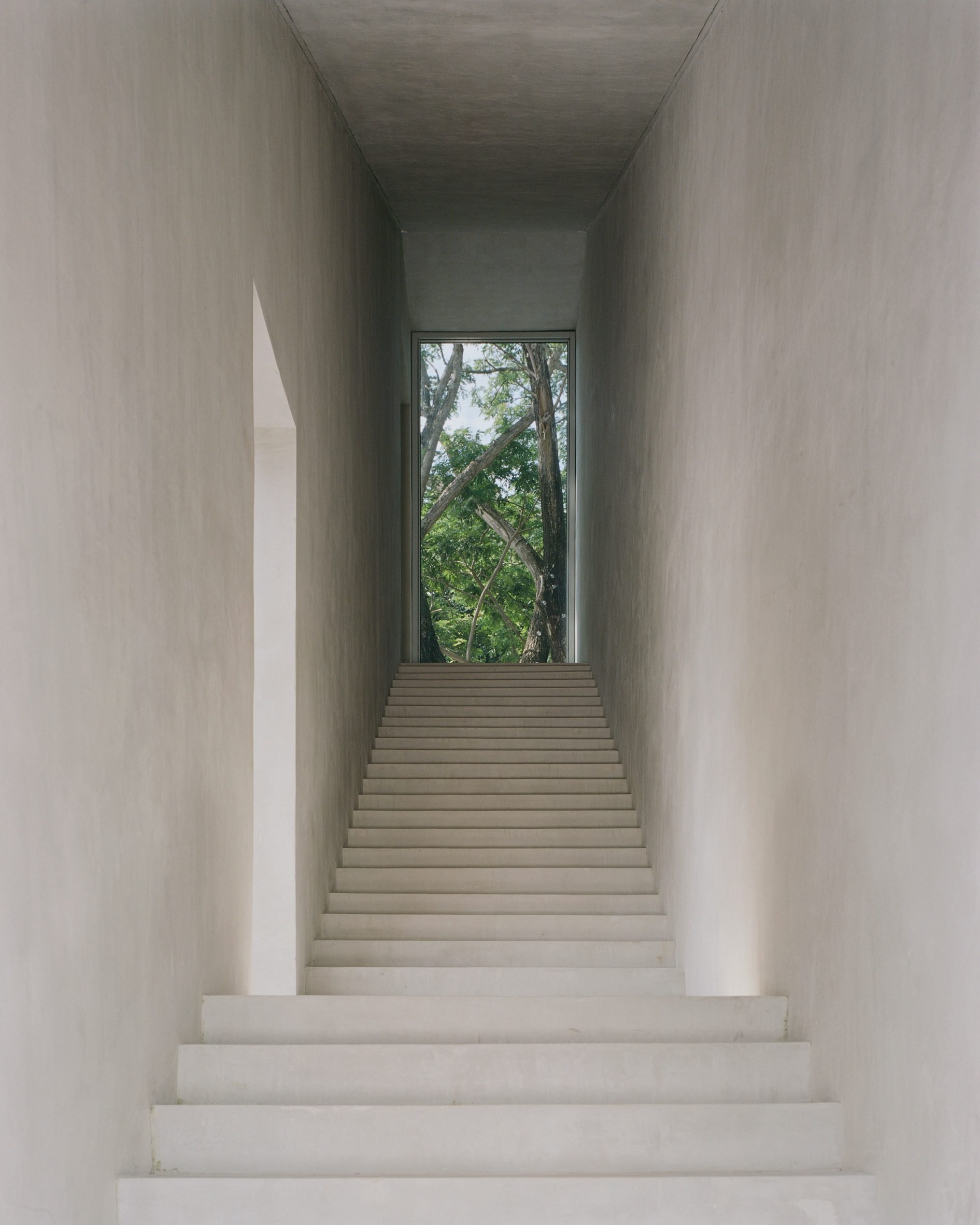 Open-air staircase at FR House in the Philippines by CAZA