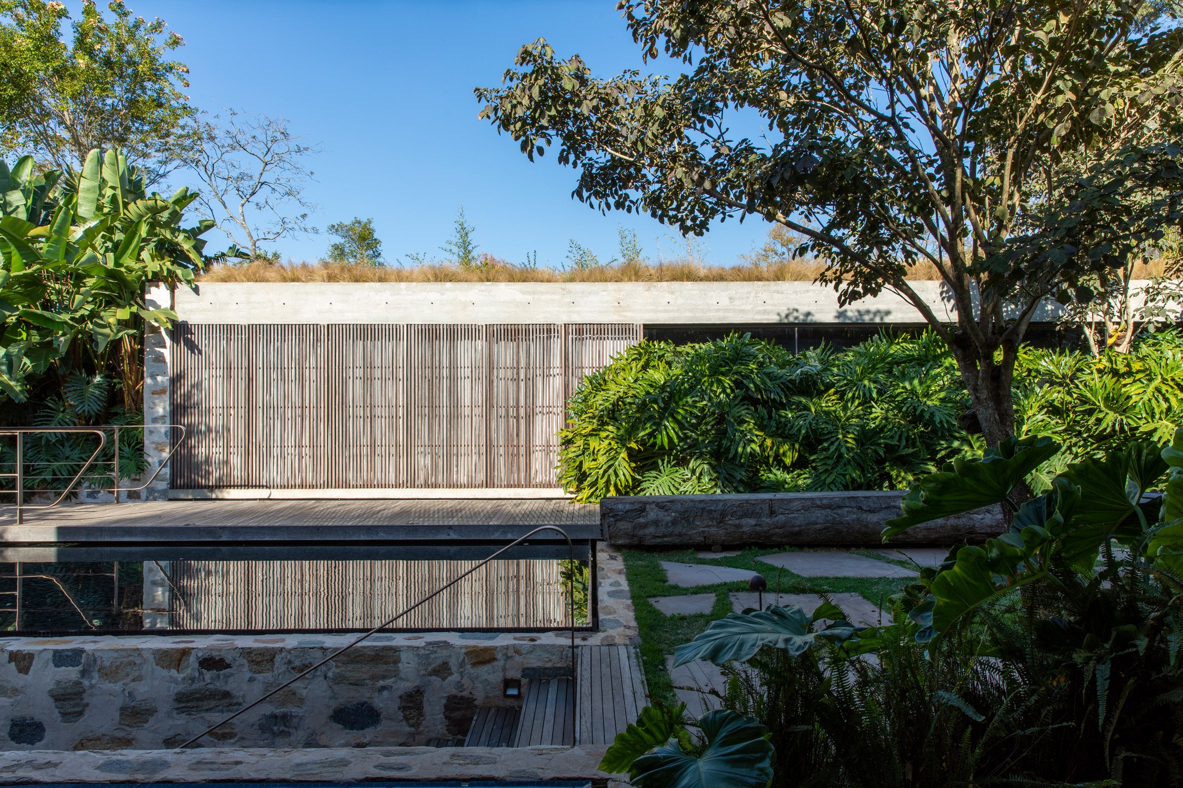 Tree-lined gardens feature throughout the property