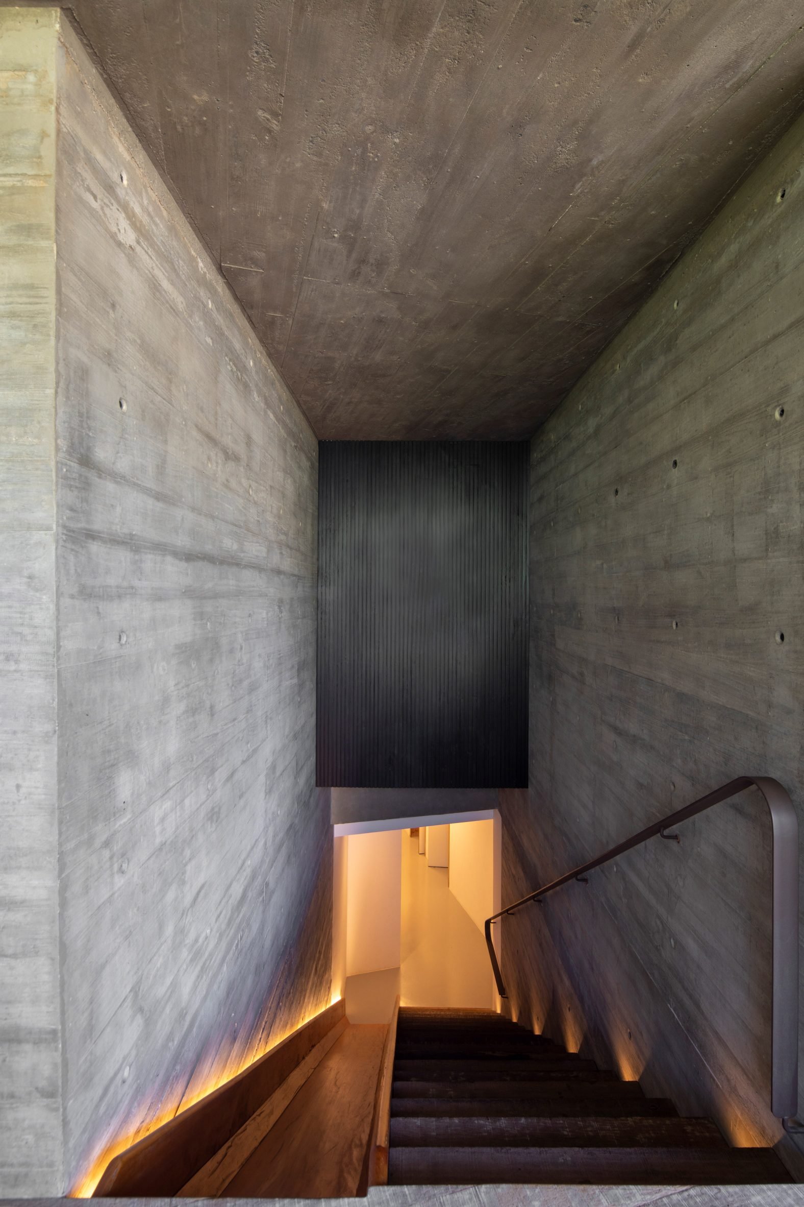 Staircase with built-in slide