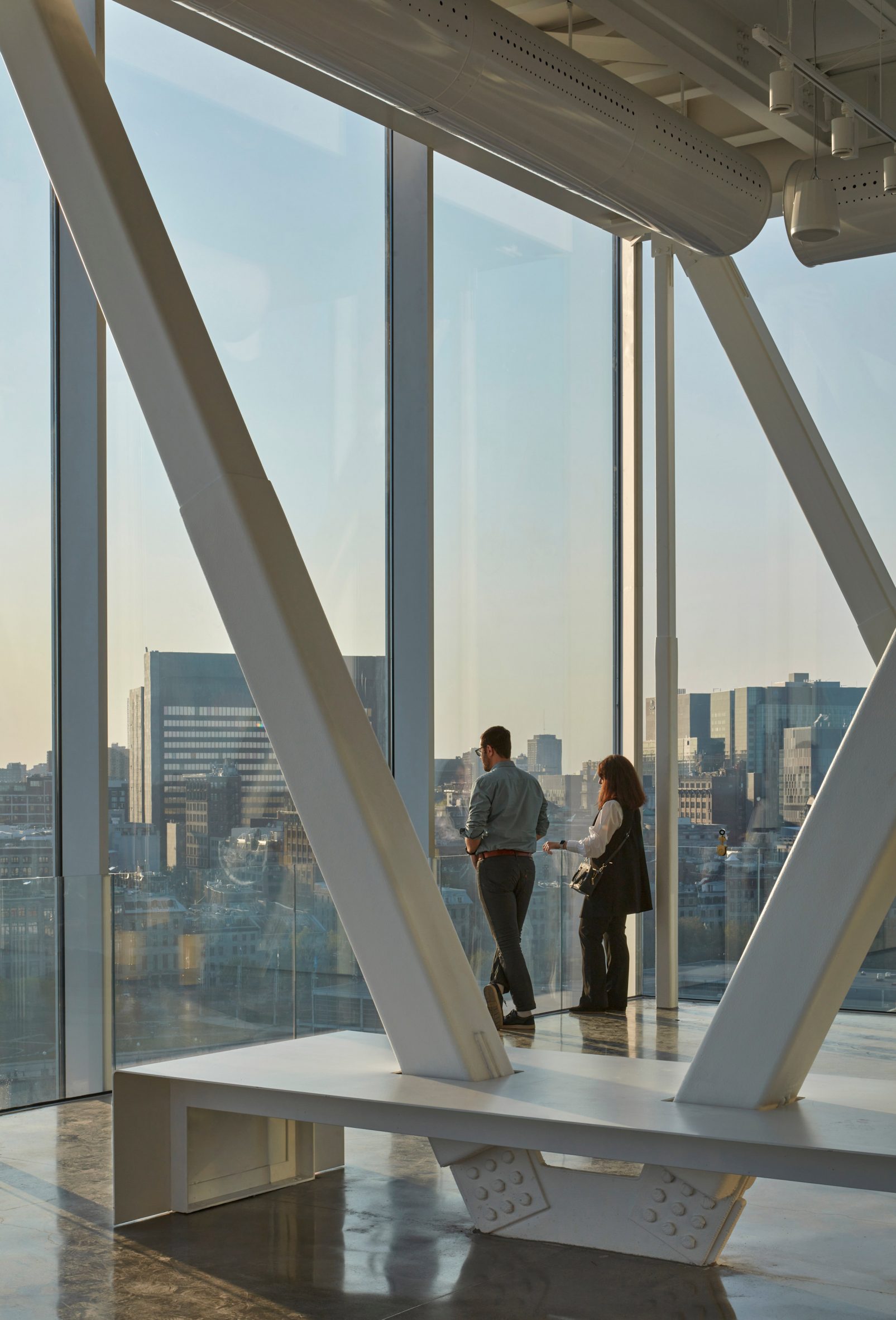 Couple at the top of Montreal port tower looking out