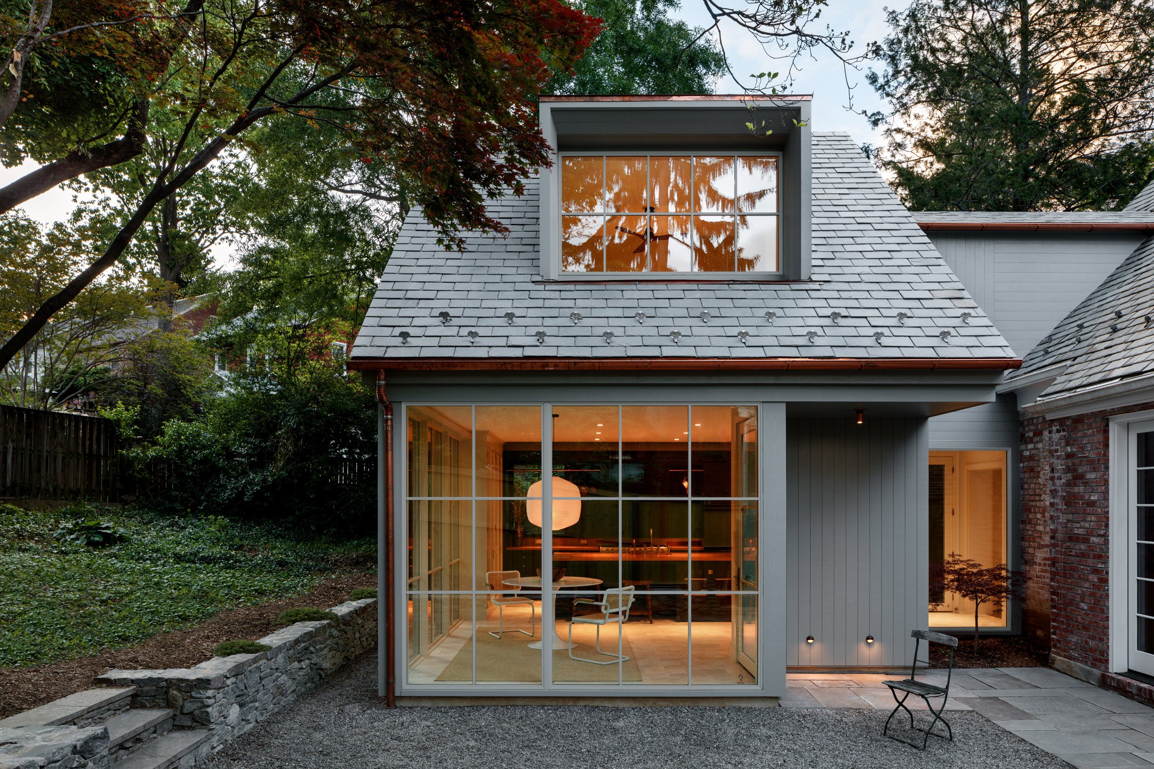 Annex and home surrounding a courtyard