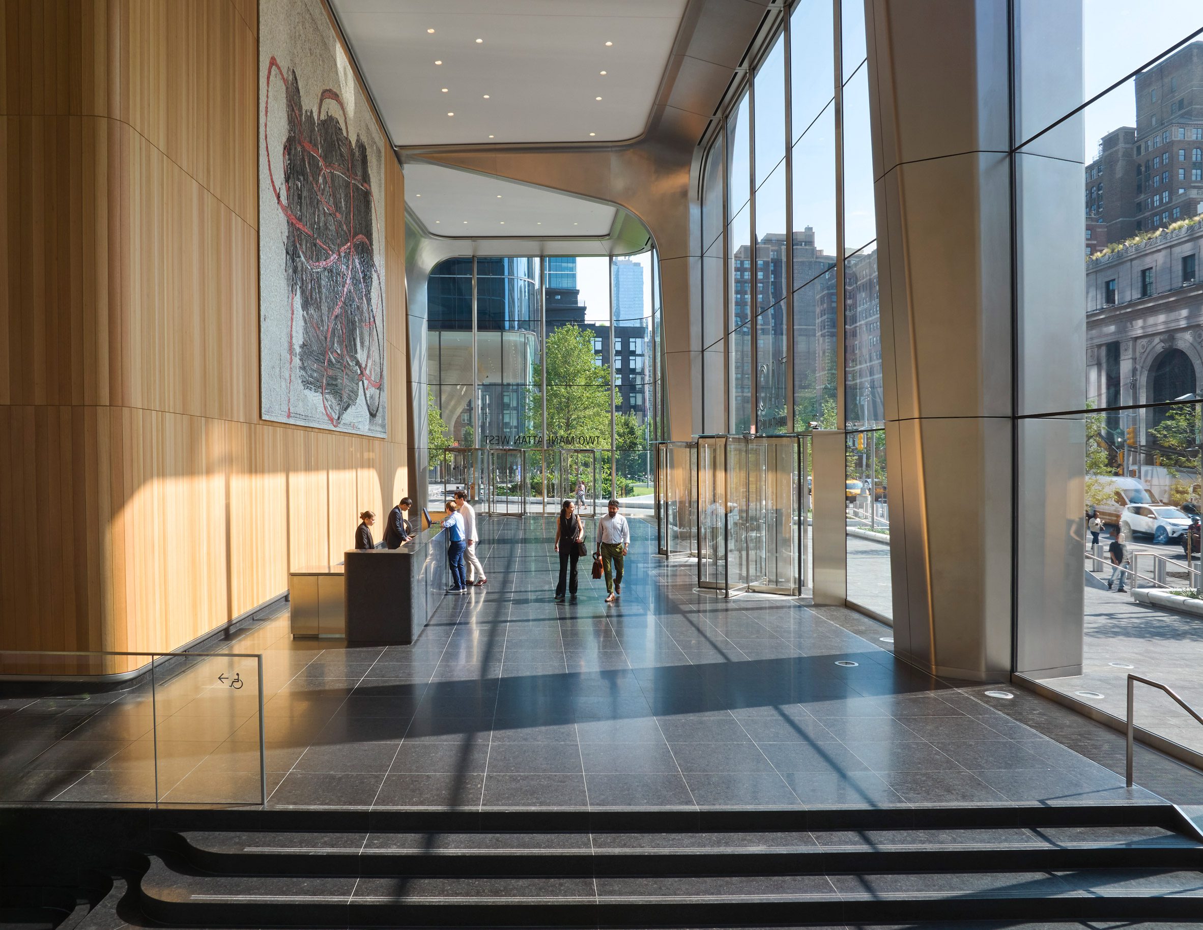 A lobby with wooden walls and large windows