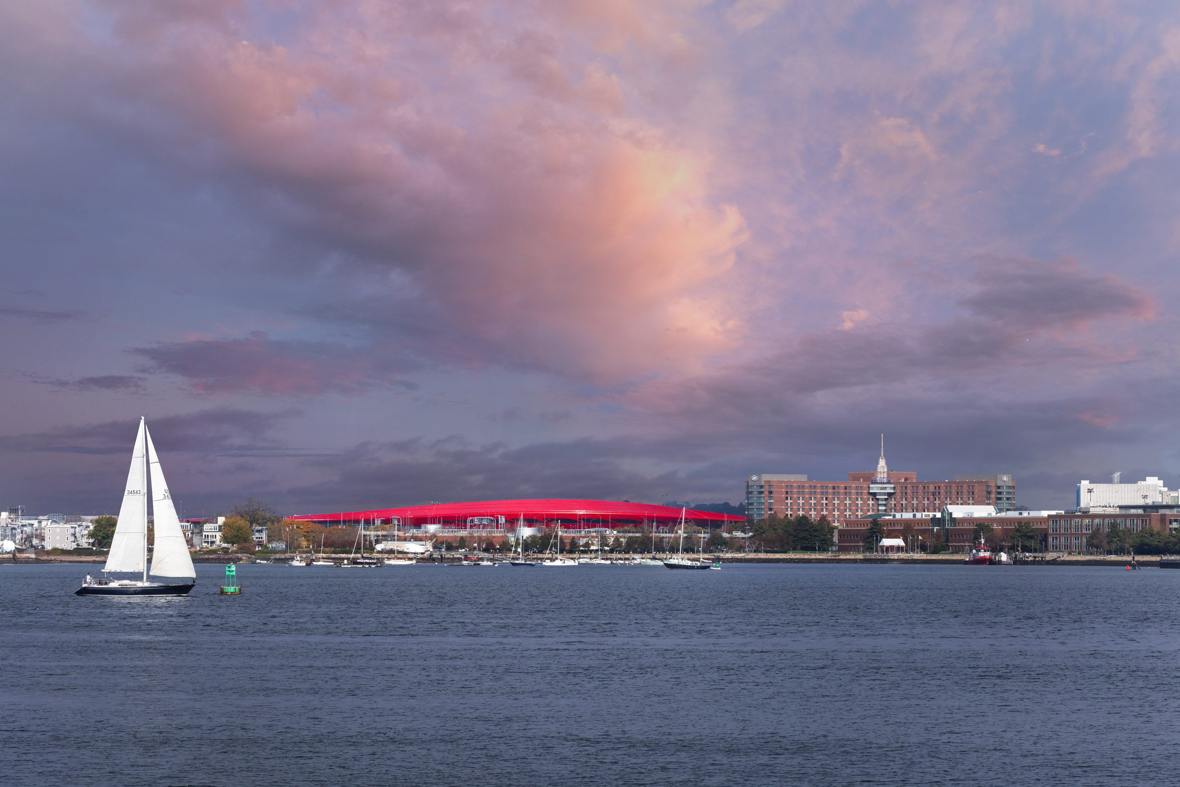 Red Boston airport roof with sailboats in Boston Habor