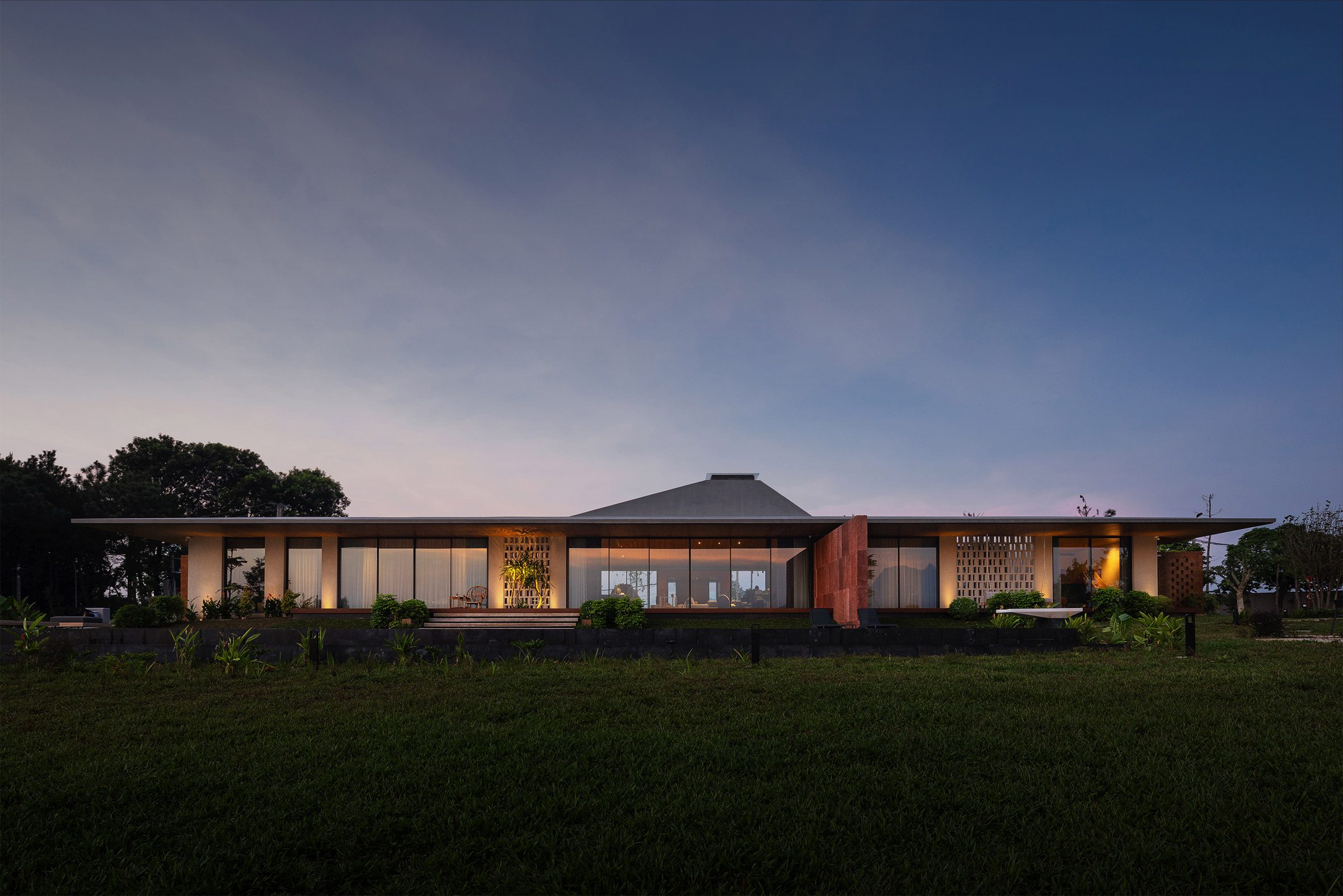Elevation dusk view of SuoiHai Villa in rural Vietnam by APDI Architects