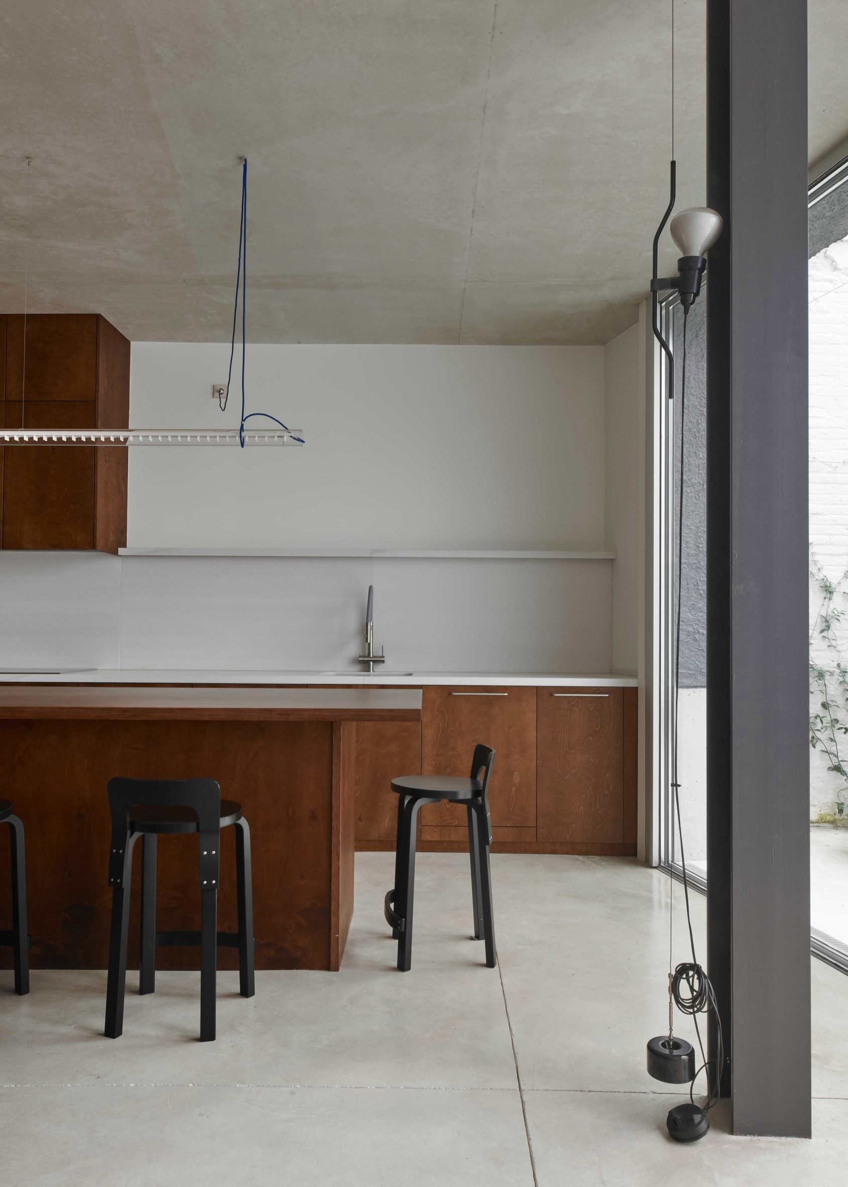 Wood-clad kitchen inside house in Barcelona by Juan Gurrea Rumeu of Gr-os