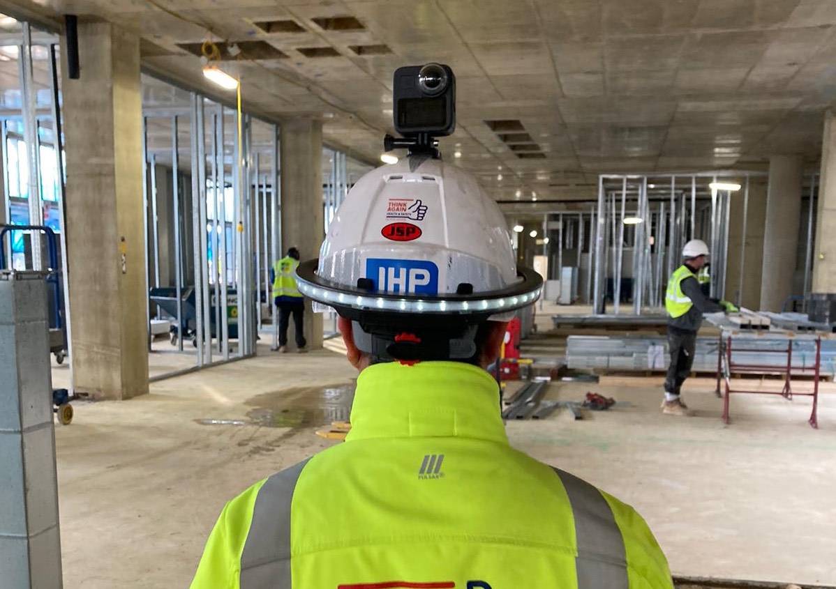 Photo of Buildots technology being used on site - illustrating performance-driven construction management story