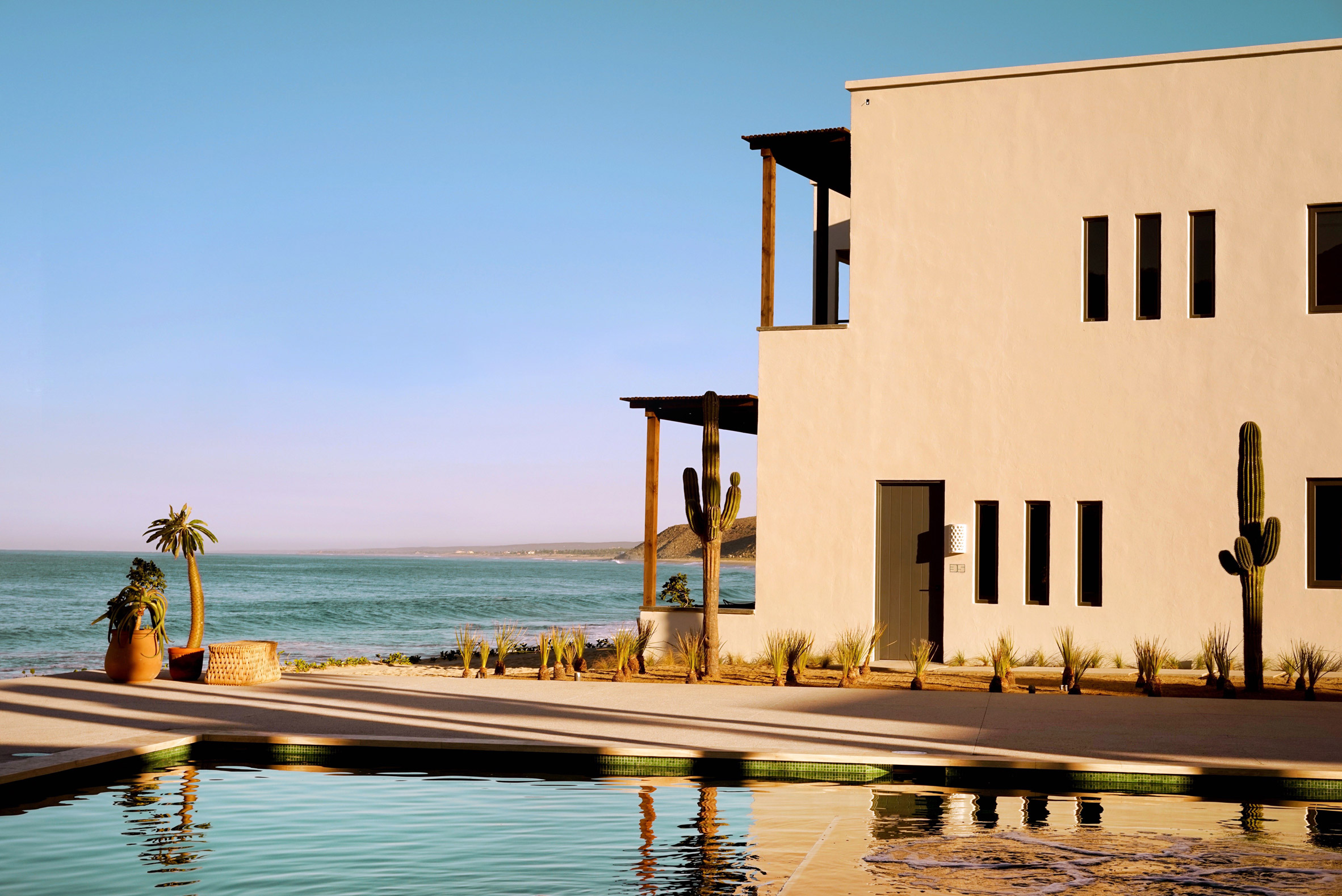 Pale plaster hotel with ocean in background