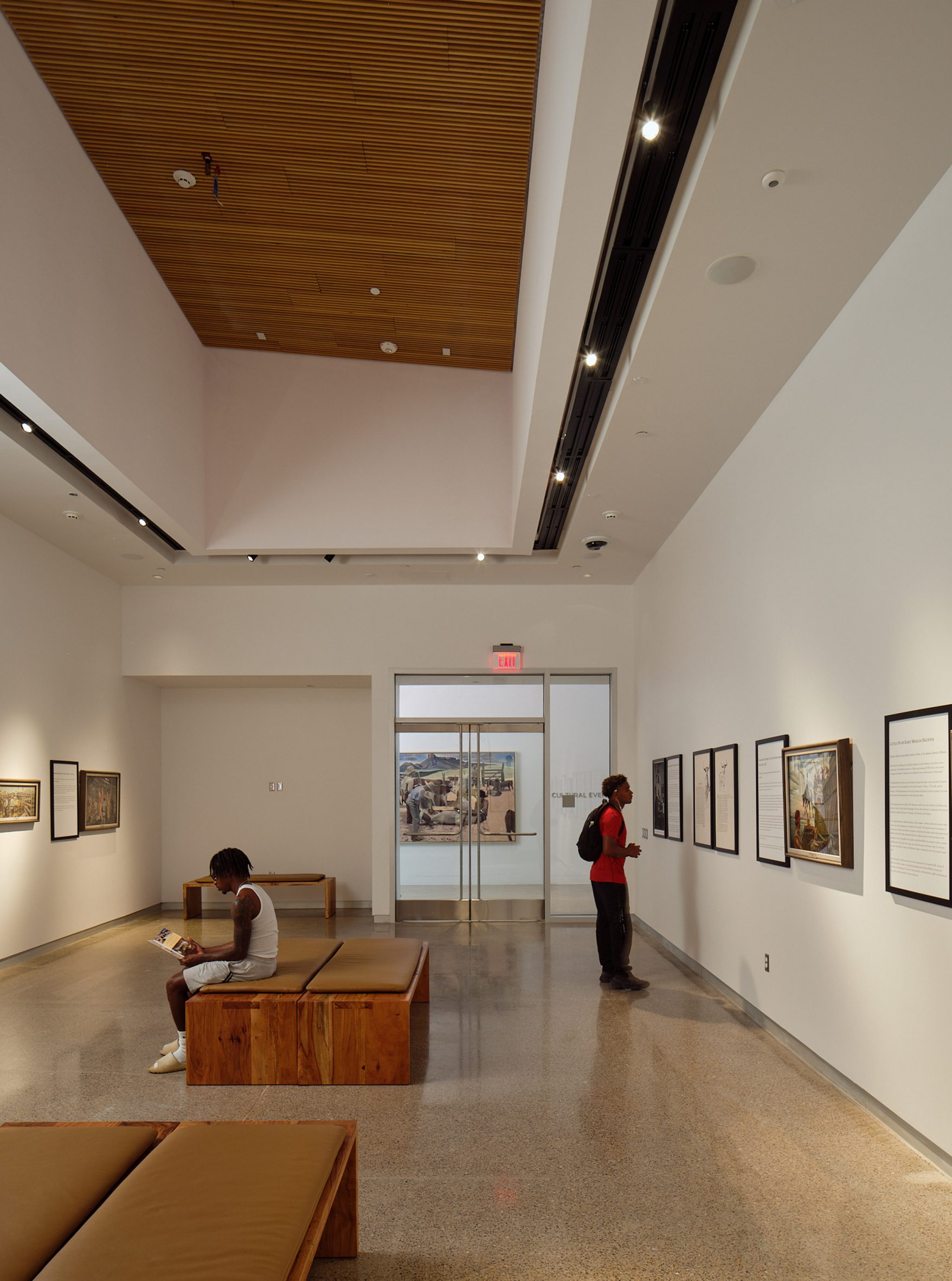 Two men in a gallery at the museum of the big bend