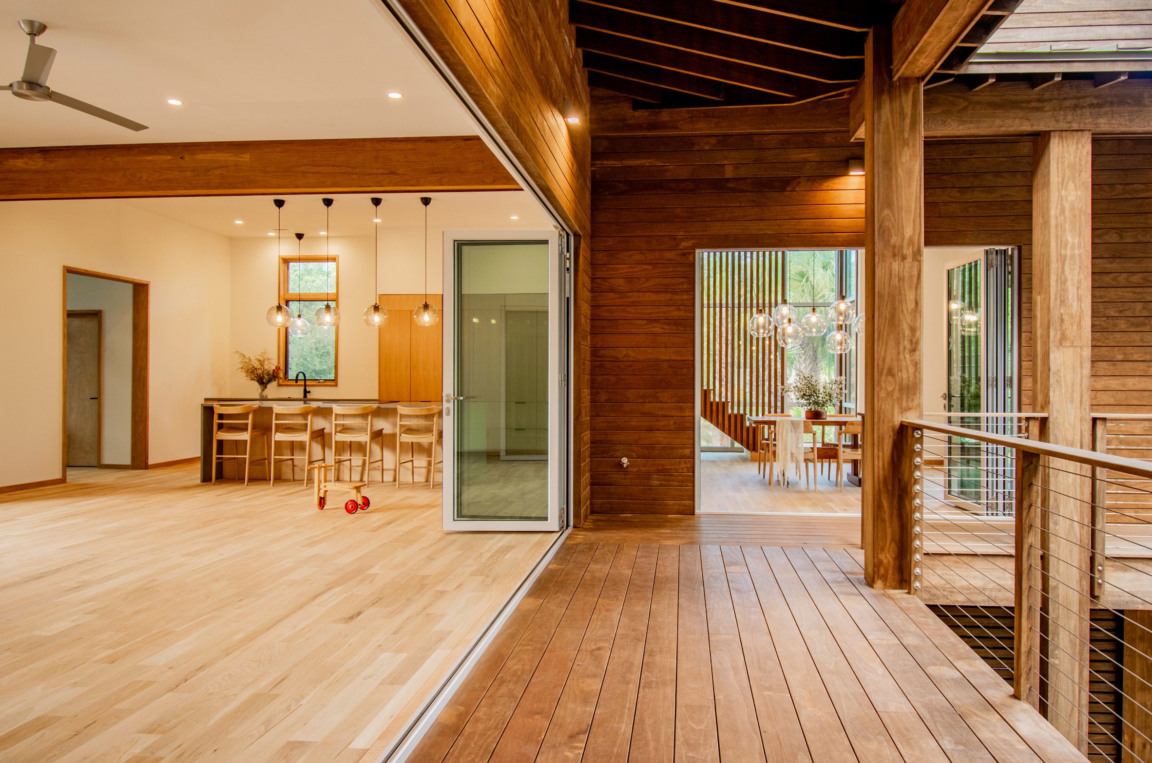 A kitchen area that leads out onto a porch