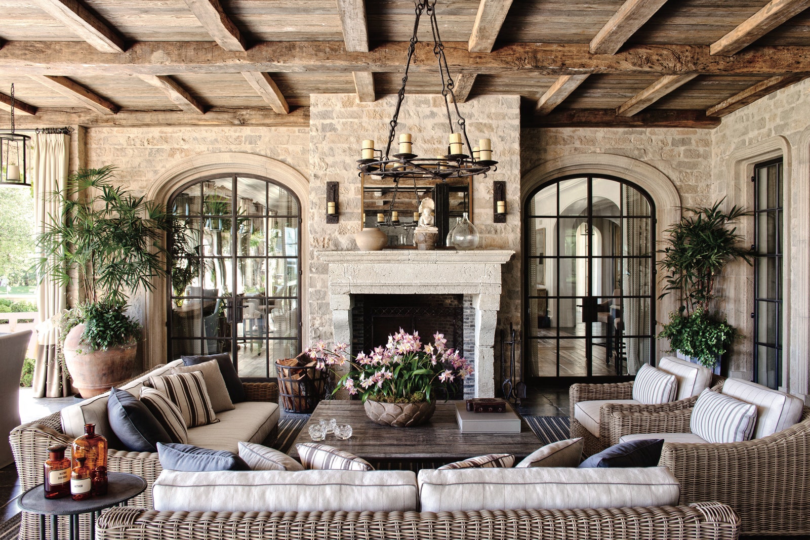 Image may contain Living Room Room Indoors Furniture Cushion Pillow Couch Interior Design Table and Fireplace