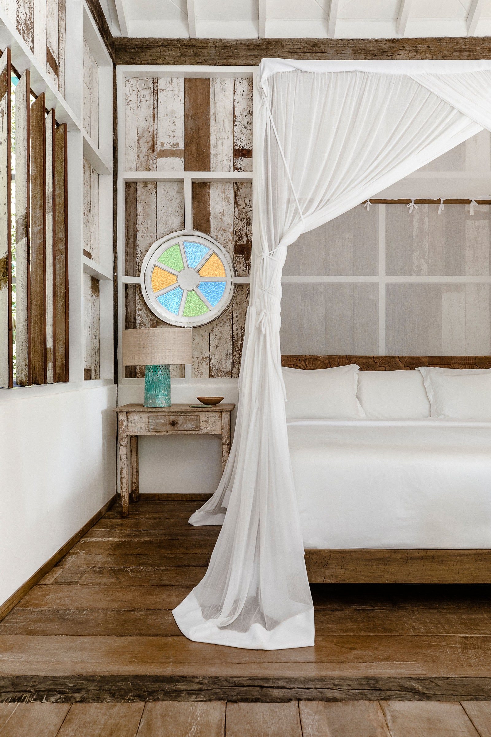 Image may contain Furniture Indoors Bed Bedroom Room Lamp Canopy Bed Desk and Table
