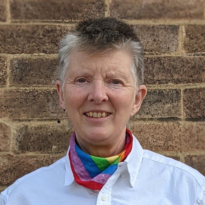 Mugshot of a woman smiling at the camera.