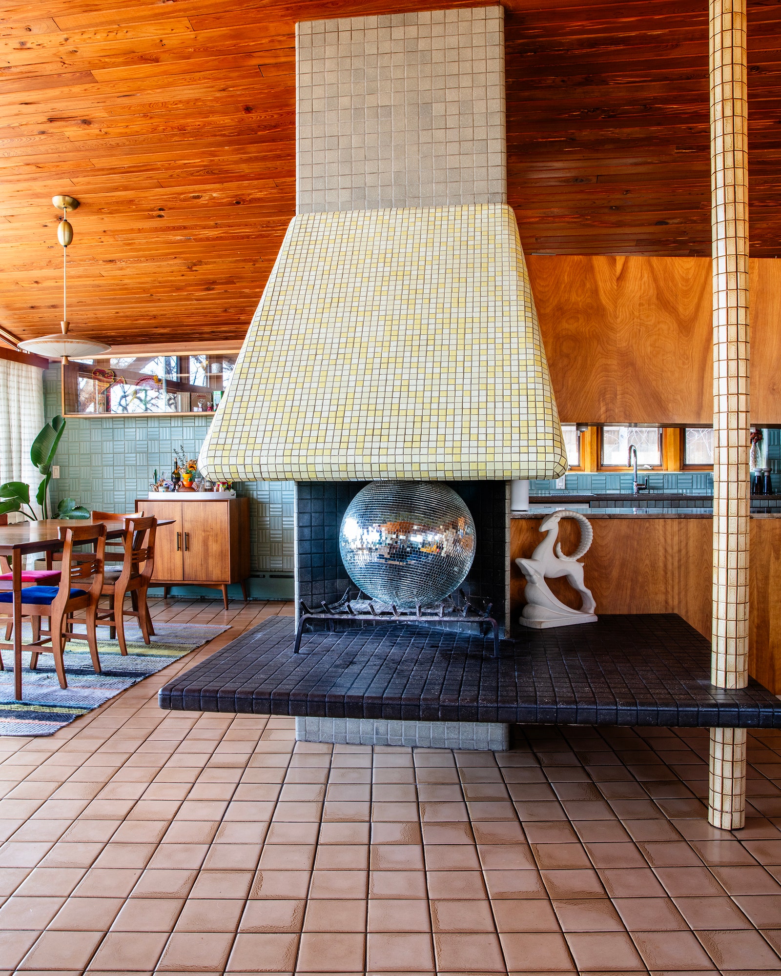 Image may contain Indoors Interior Design Floor Flooring Lamp Wood Home Decor Rug Hardwood Chair and Furniture