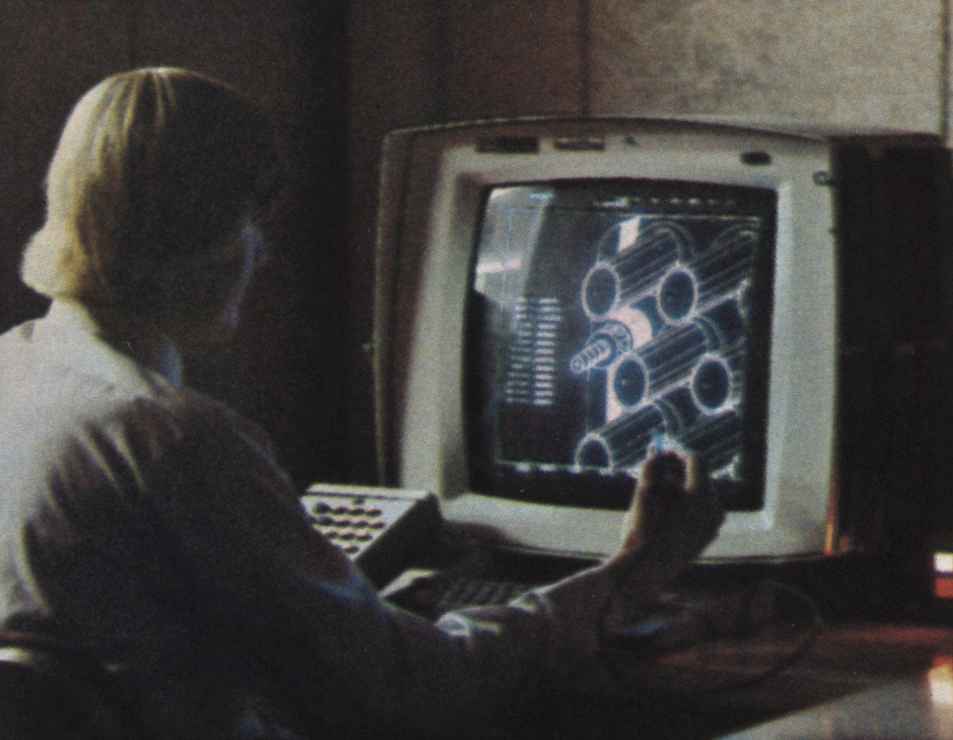 Engineer_working_on_CAD_workstation_with_light_pen_Hughes_Aircraft_Company.jpg