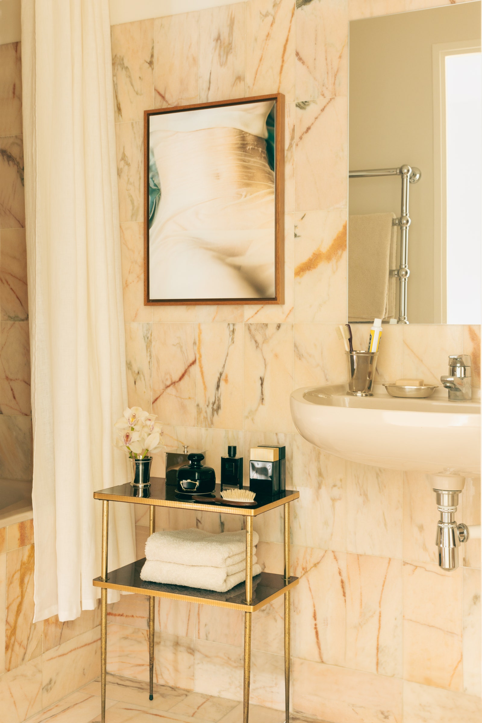 Image may contain Indoors Interior Design Sink Sink Faucet Cup Art Painting Basin and Person