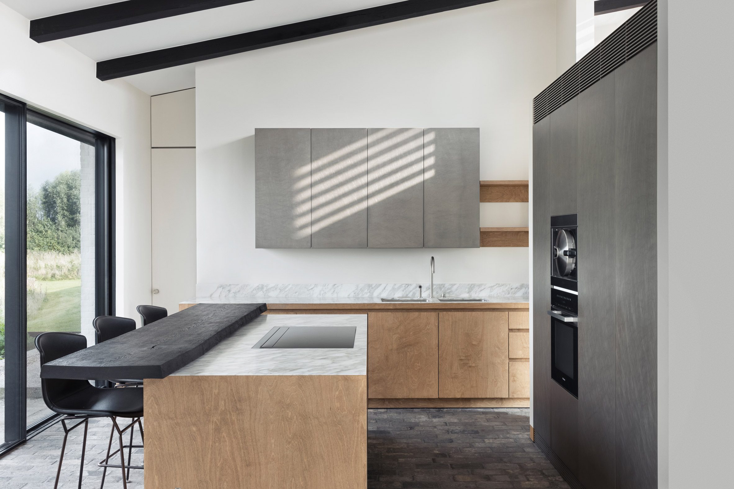 Kitchen area within House in the Fields by Stef Claes