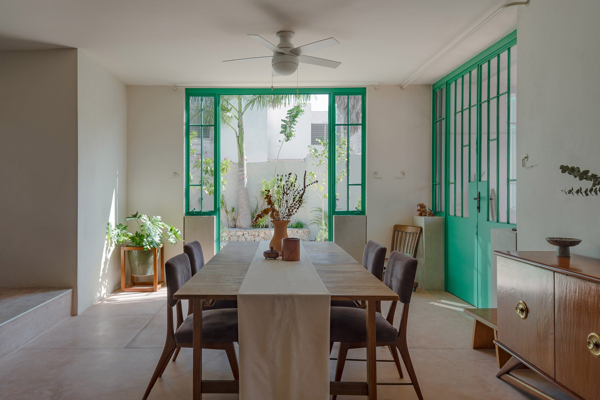 Green wrought iron French doors