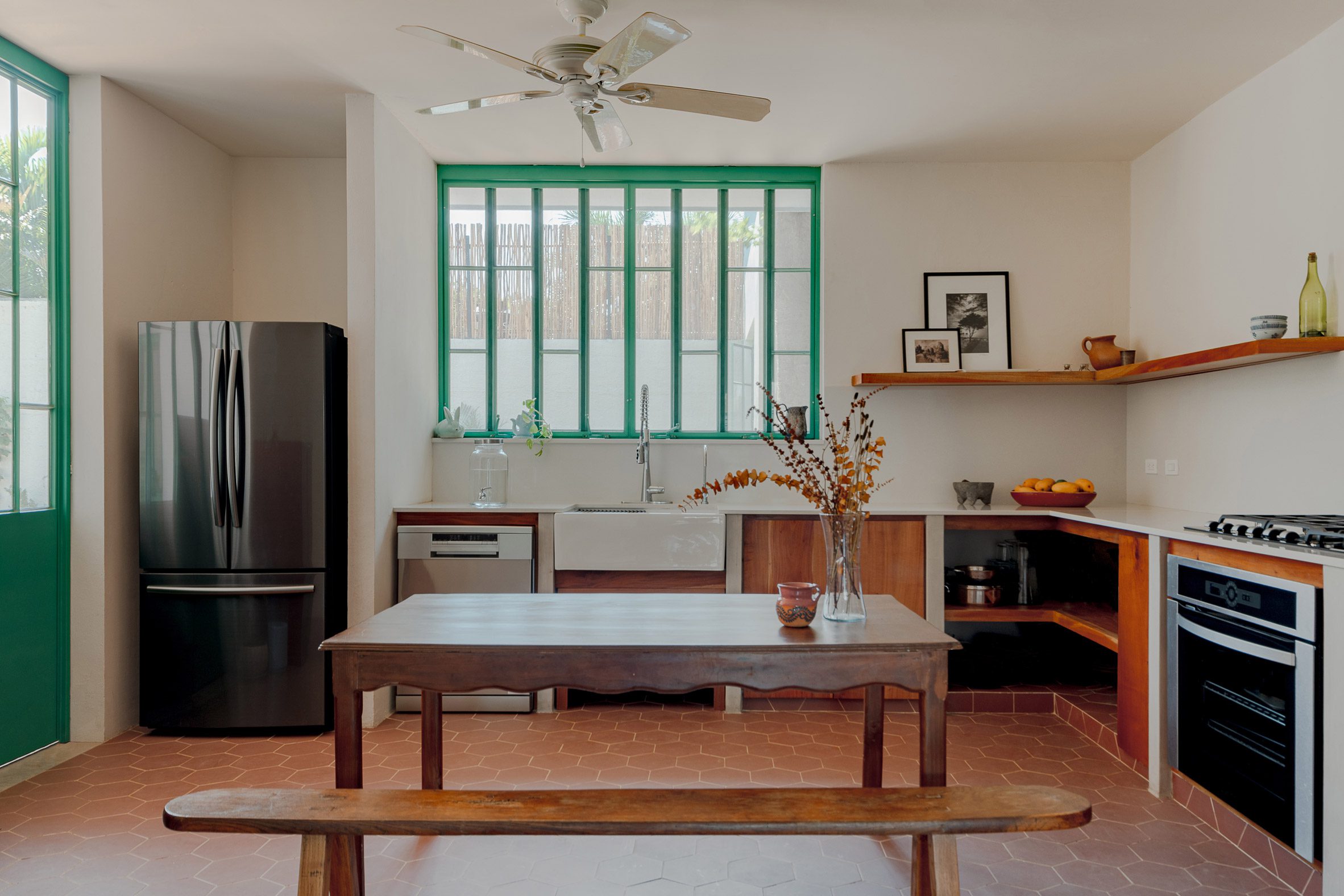 Kitchen with green-lined windows