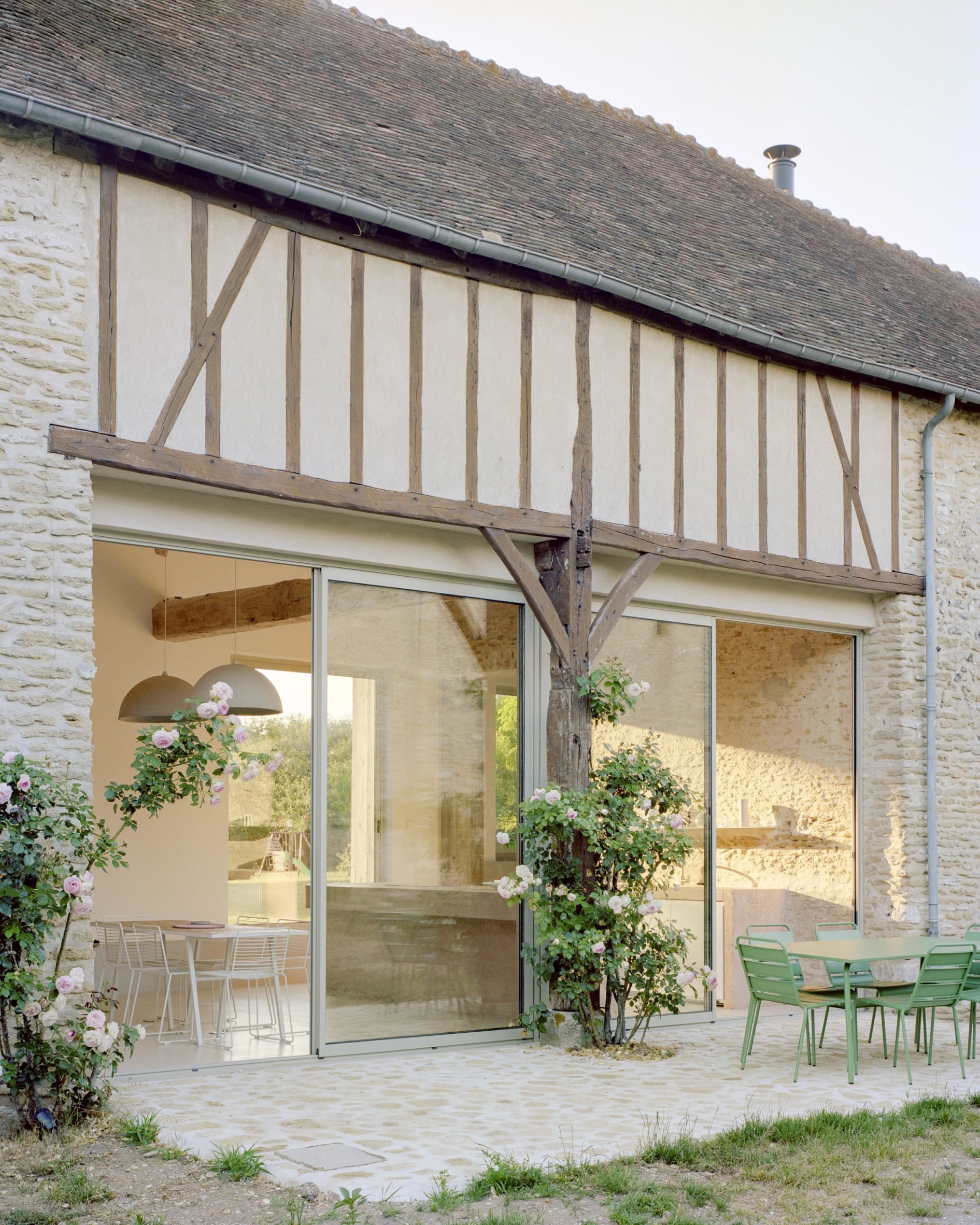 Open terrace at Maison Hercourt by Studio Guma in Normandy