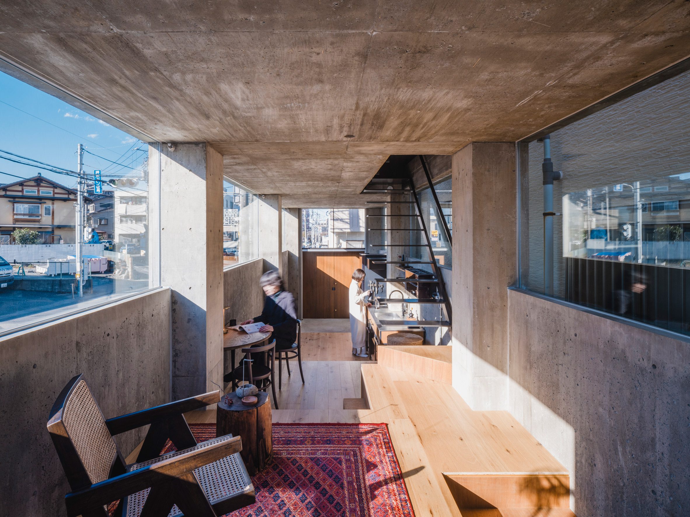 Living space interior within narrow Japanese home by IGArchitects