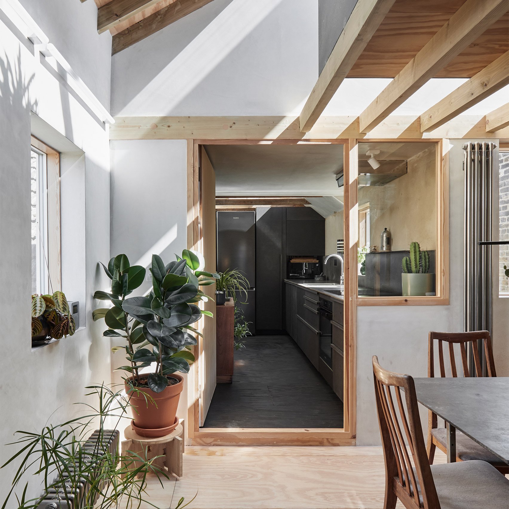 Interior of Apartment with a Mezzanine by Office Ten Architecture